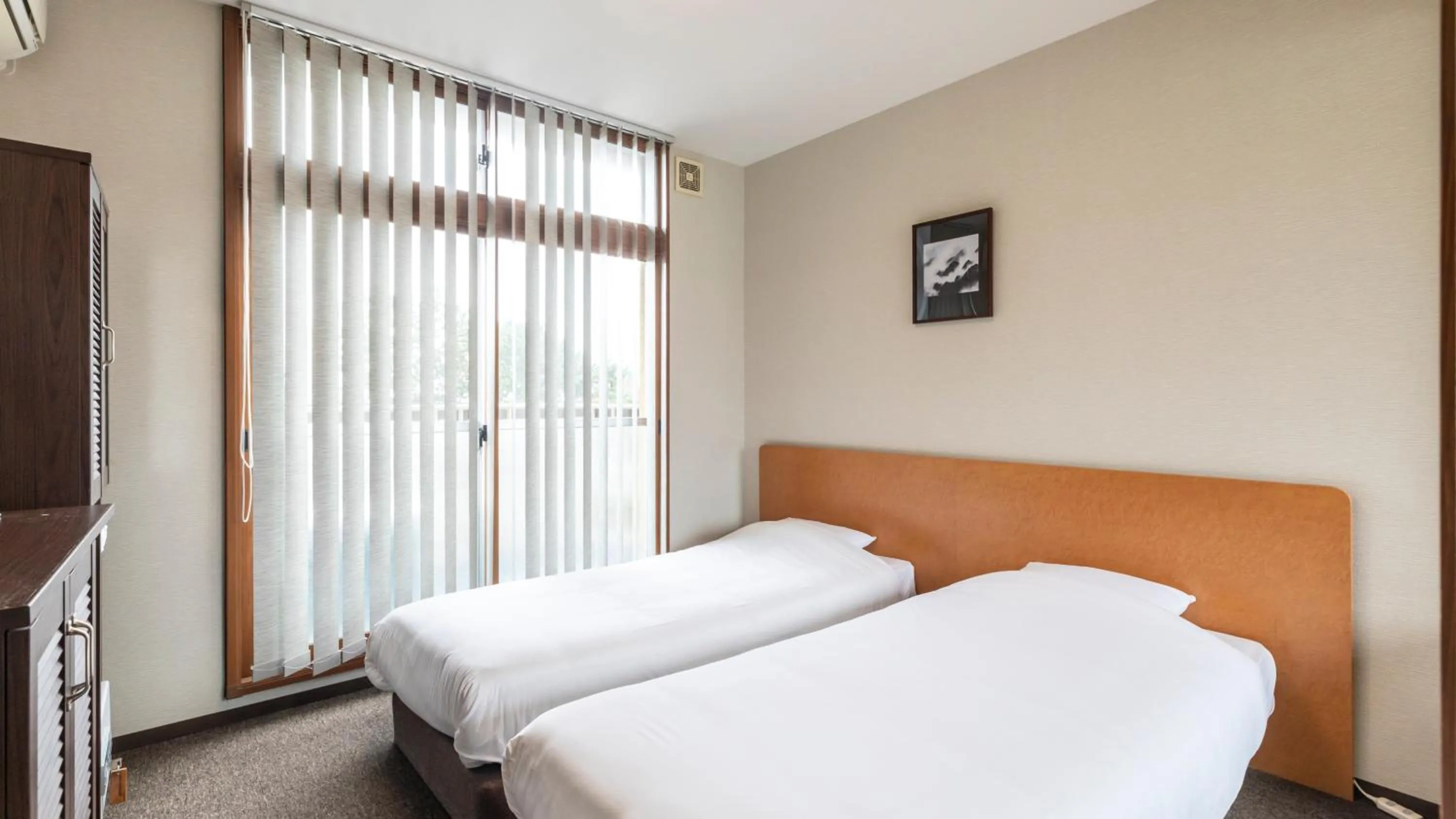 Bed in Tabist International Hotel Kaike