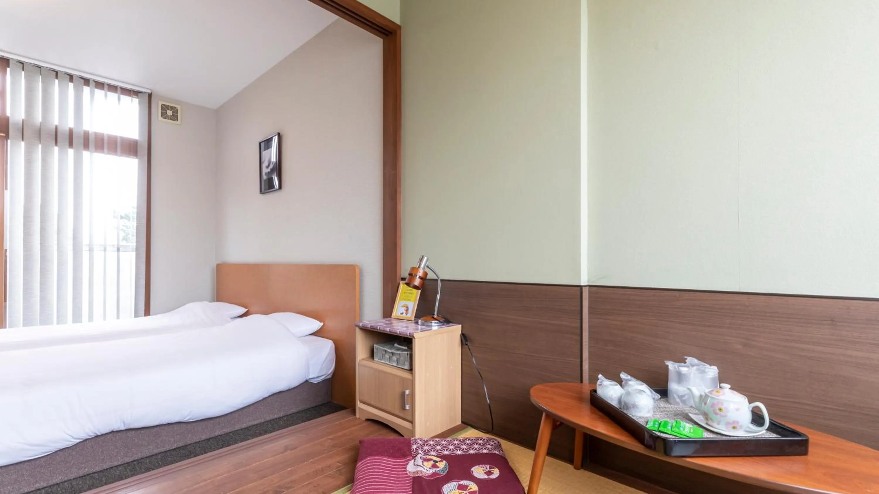 Bed in Tabist International Hotel Kaike