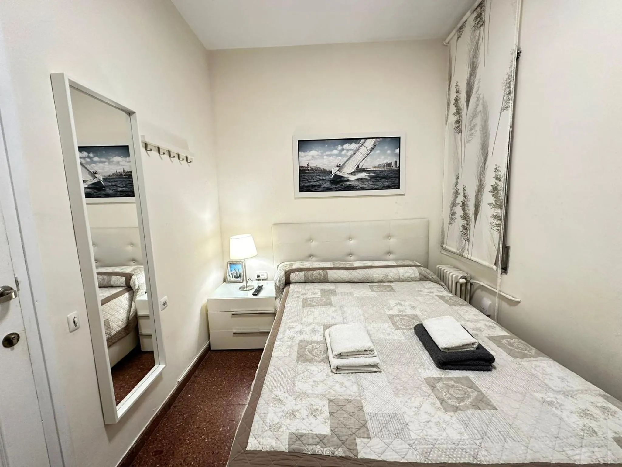 Bed in Viladomat Rooms