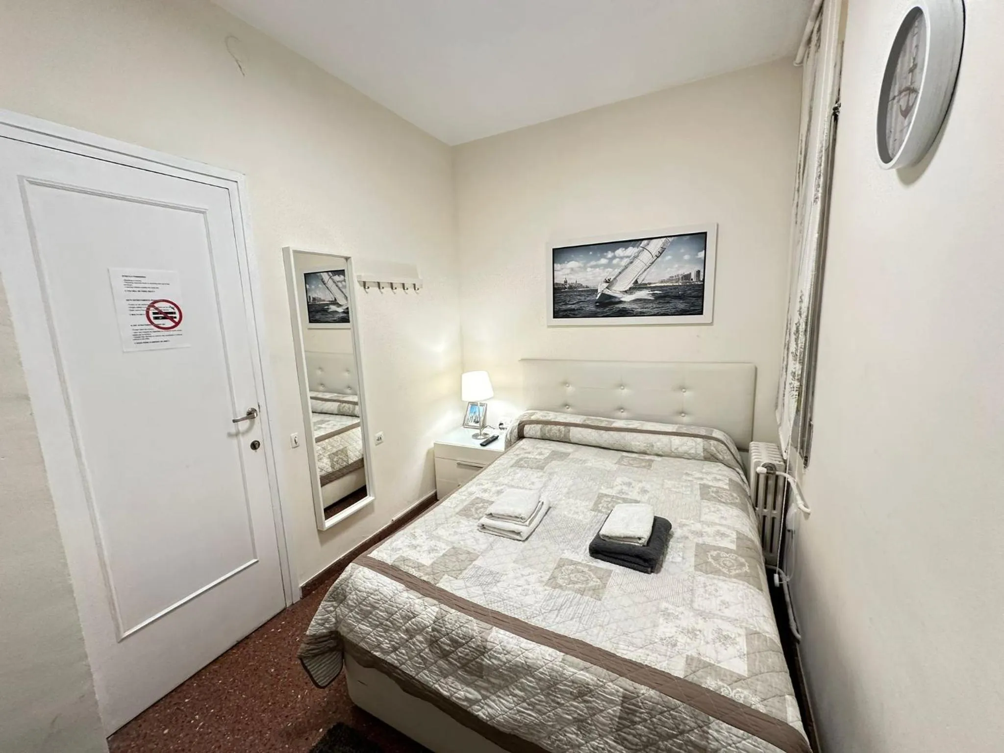 Bed in Viladomat Rooms