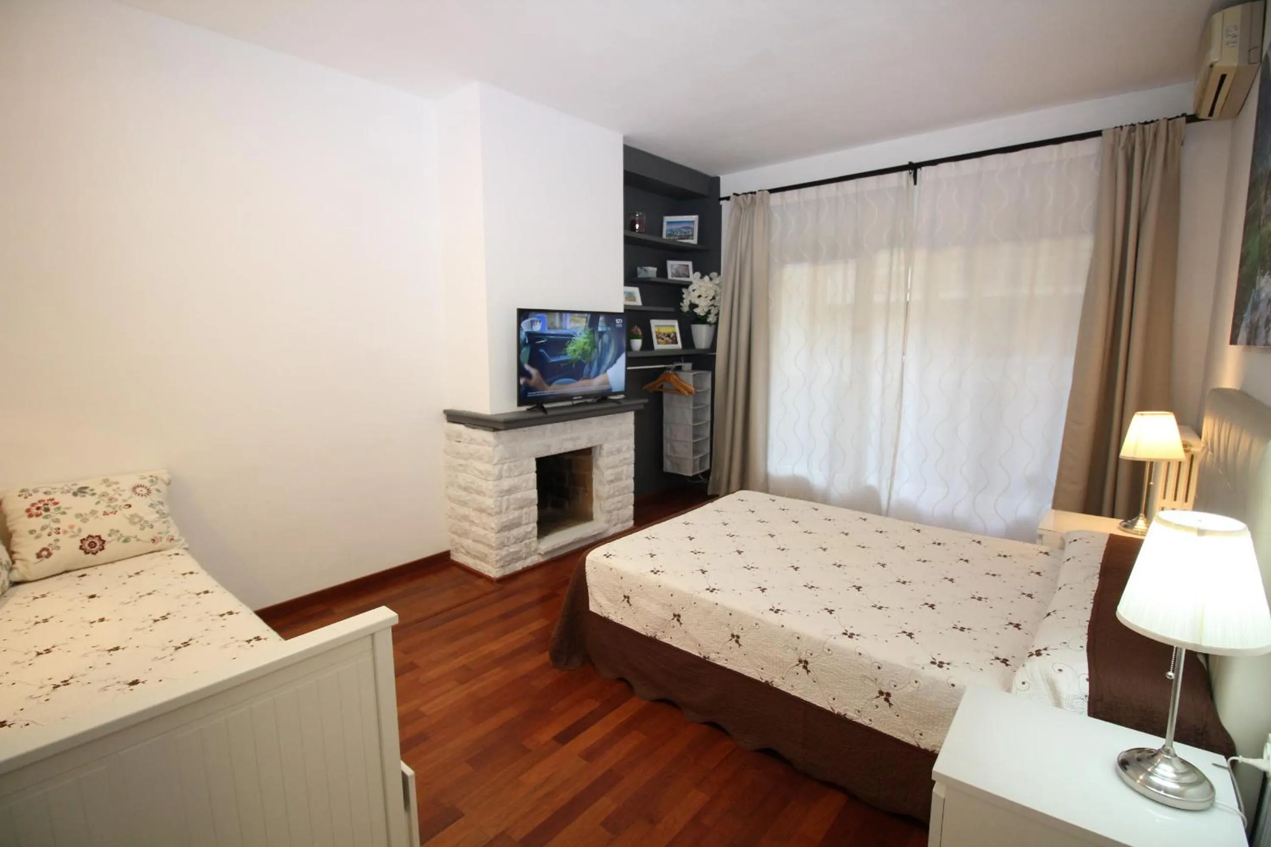 Bed in Viladomat Rooms