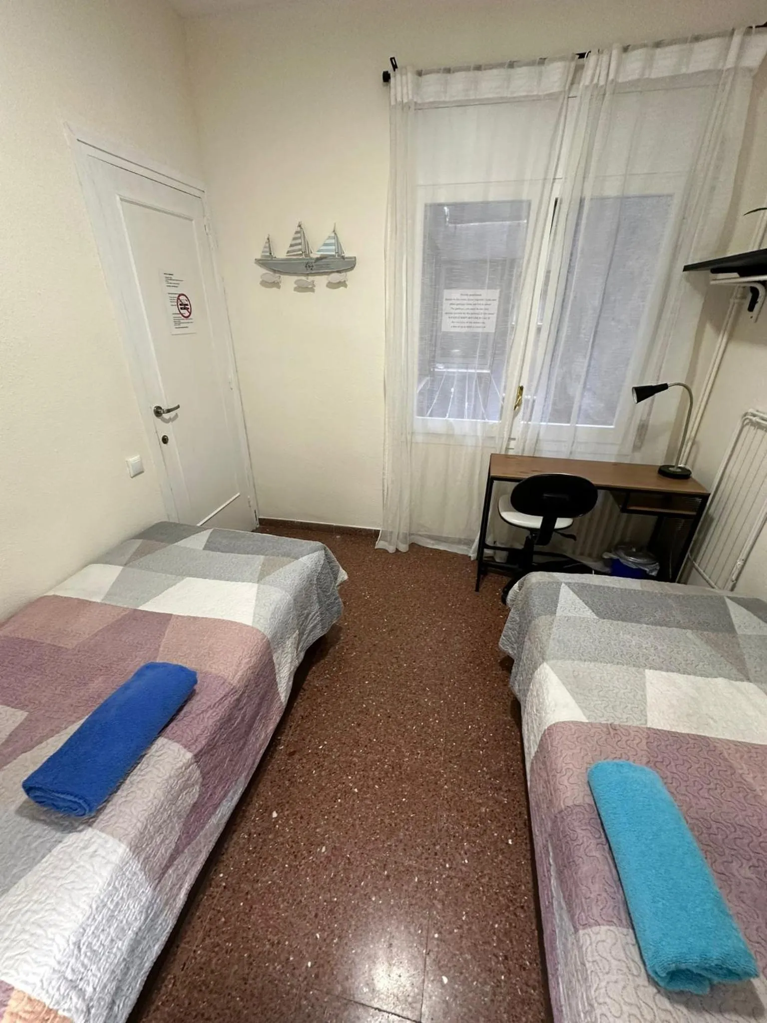 Bed in Viladomat Rooms