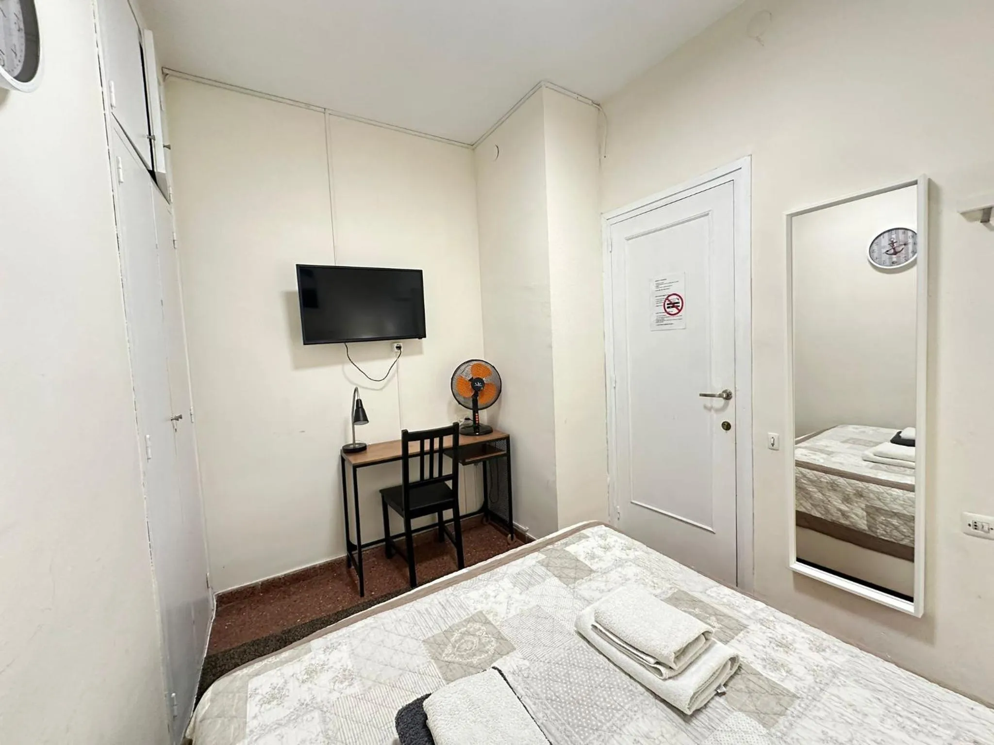 Bed in Viladomat Rooms