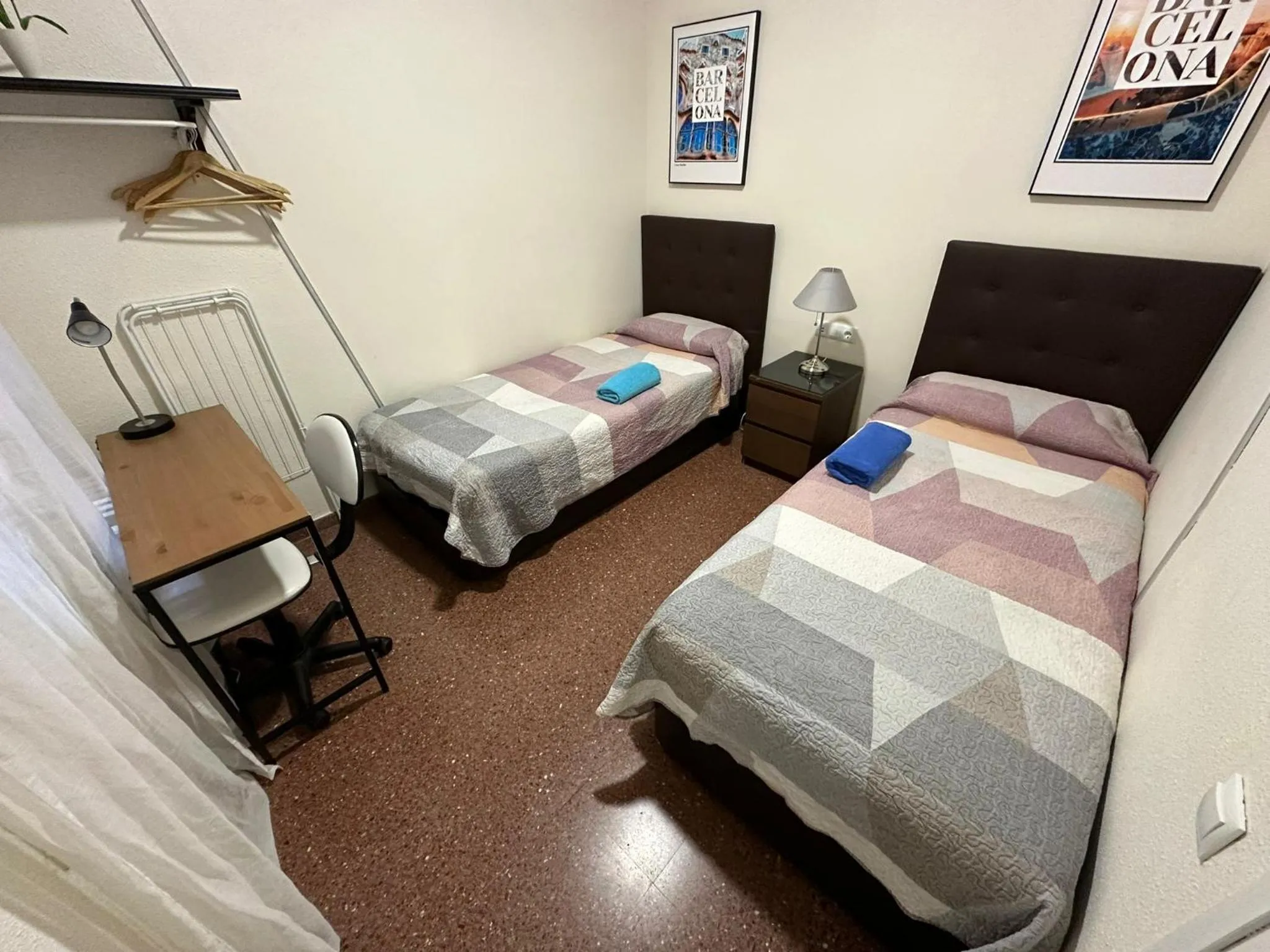 Bed in Viladomat Rooms