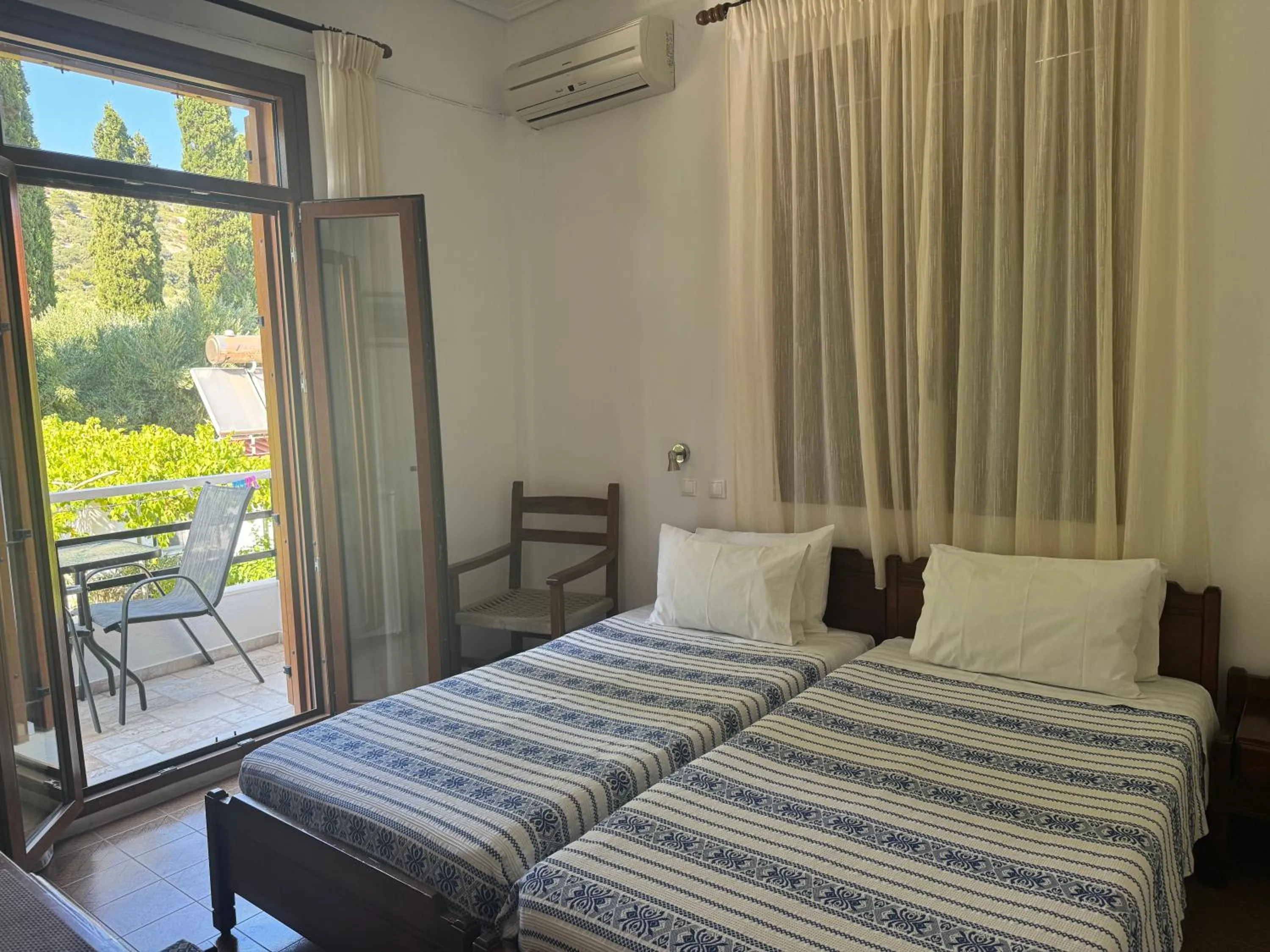 Bed in Pythaïs Hotel