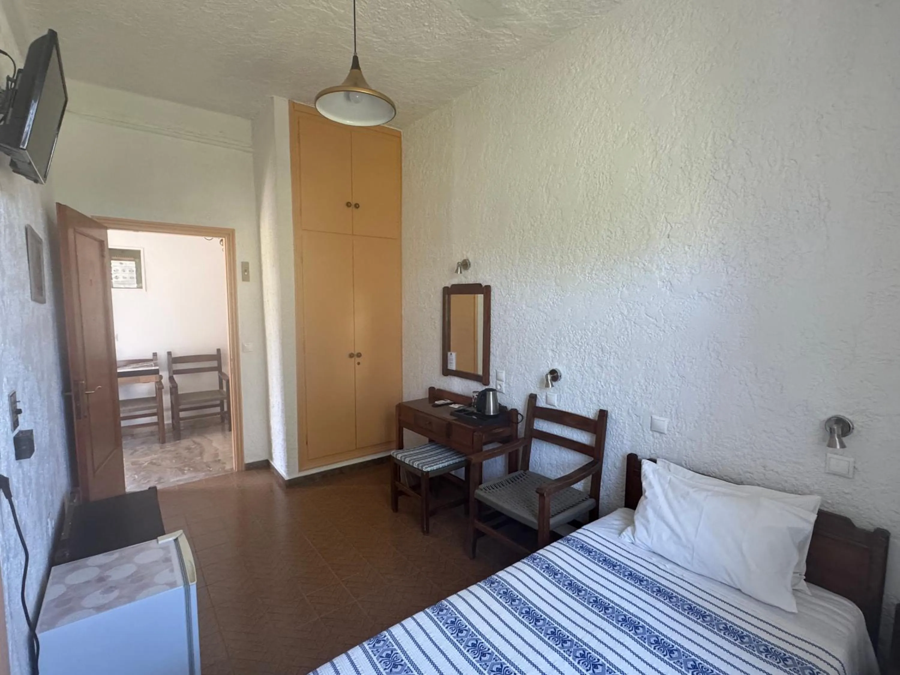 Bed in Pythaïs Hotel