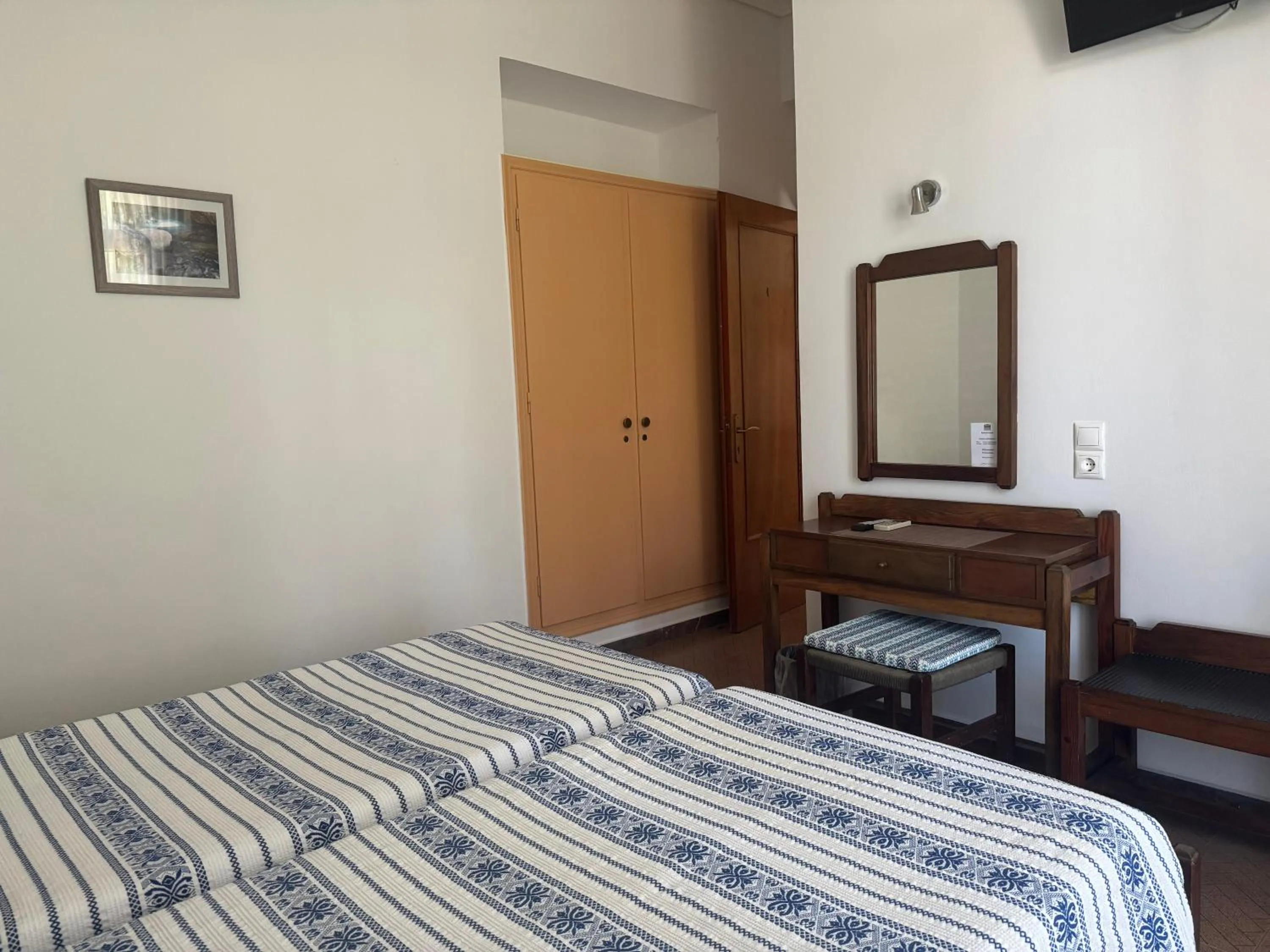 Bed in Pythaïs Hotel