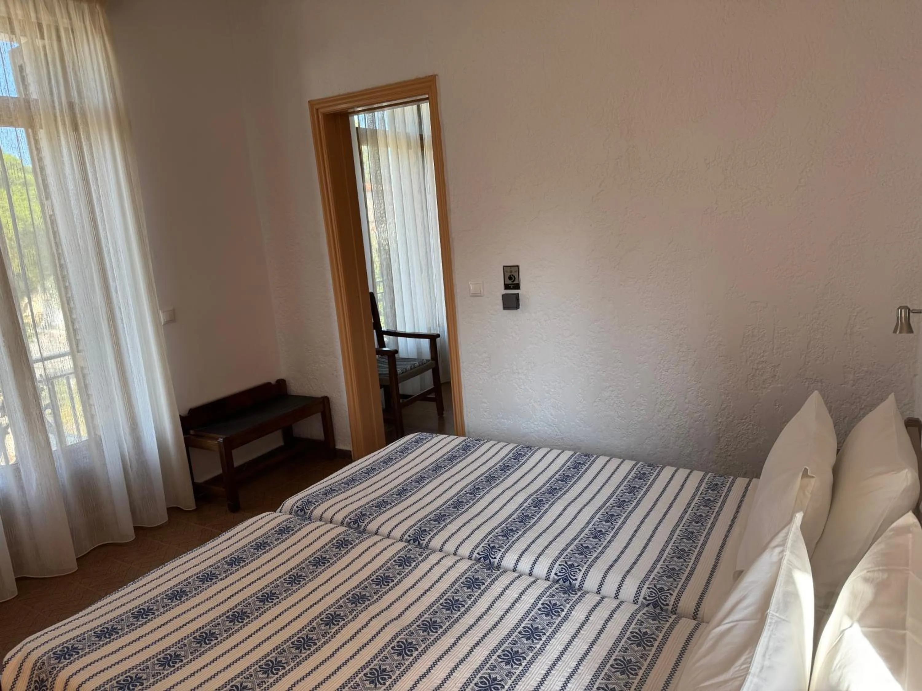 Bed in Pythaïs Hotel