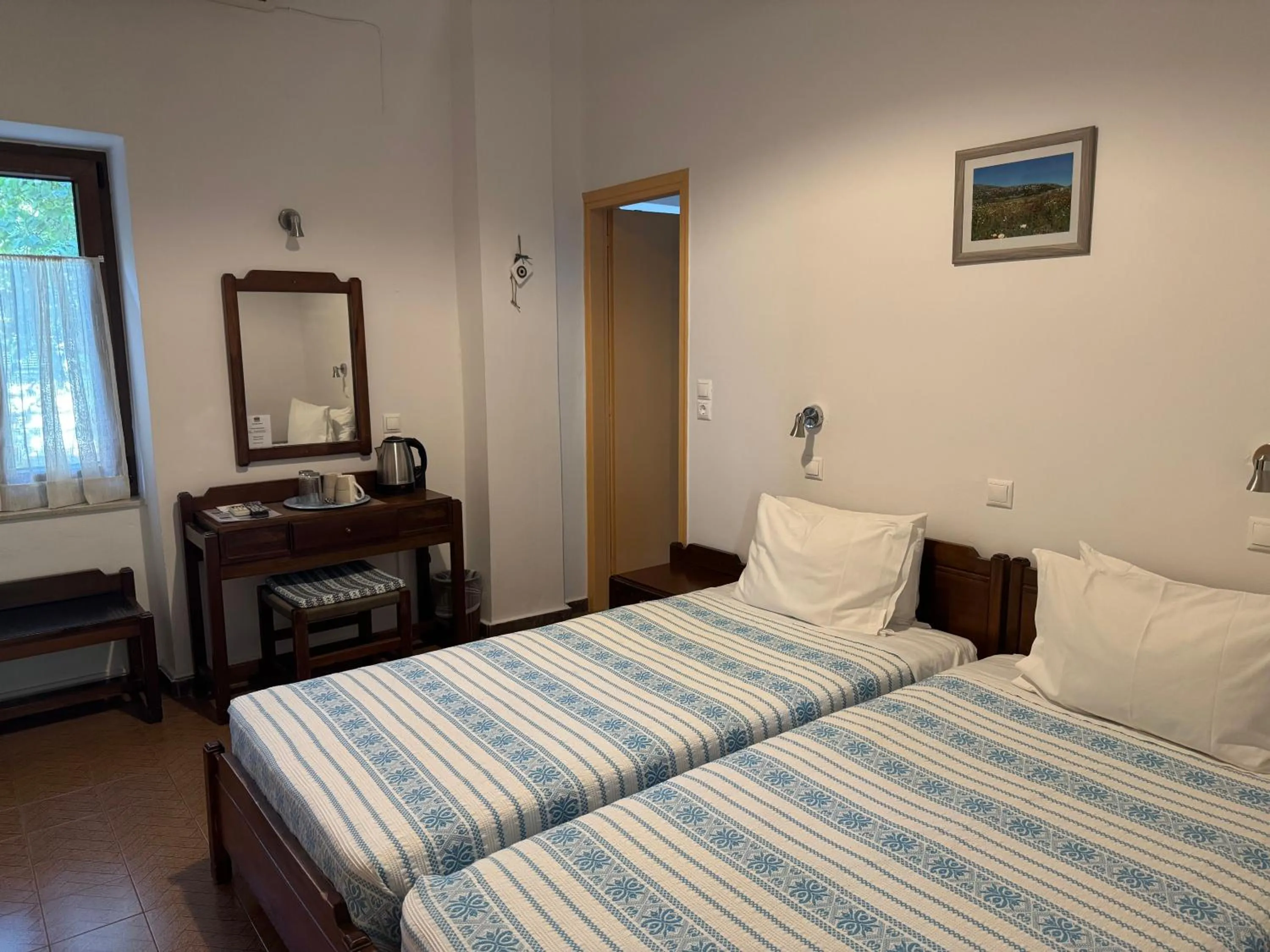 Bed in Pythaïs Hotel