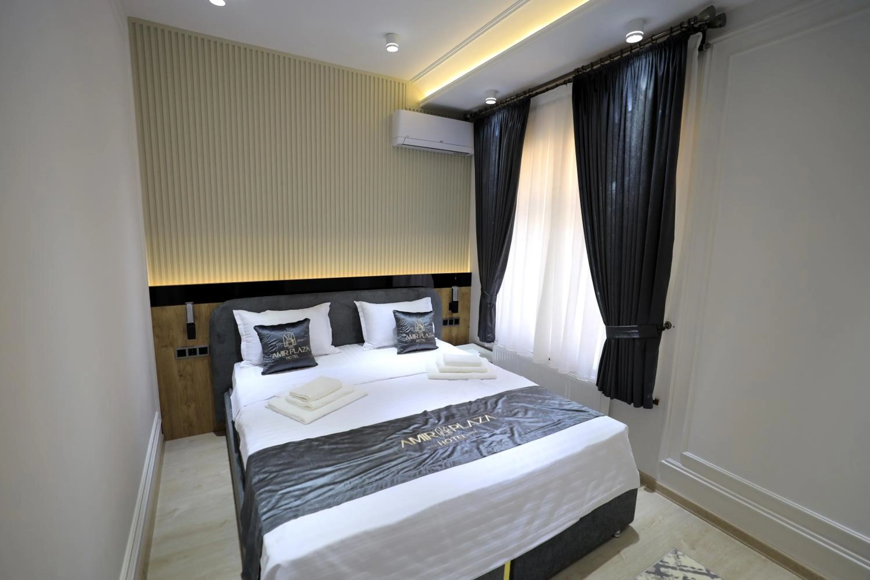 Bed in AMIR PLAZA hotel