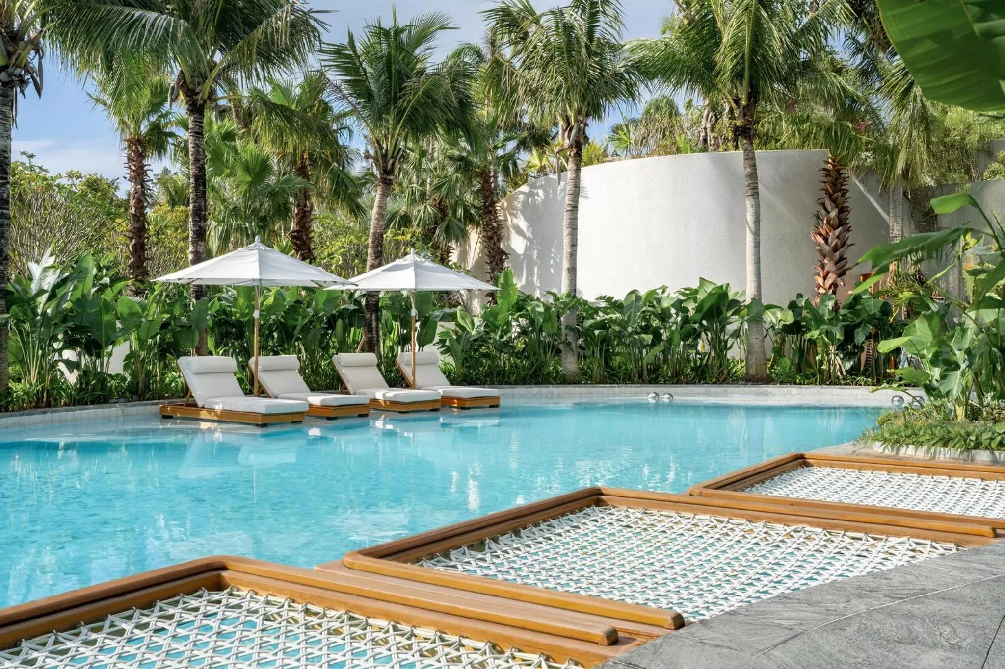 Swimming pool in Kimpton Aqeos Hainan by IHG