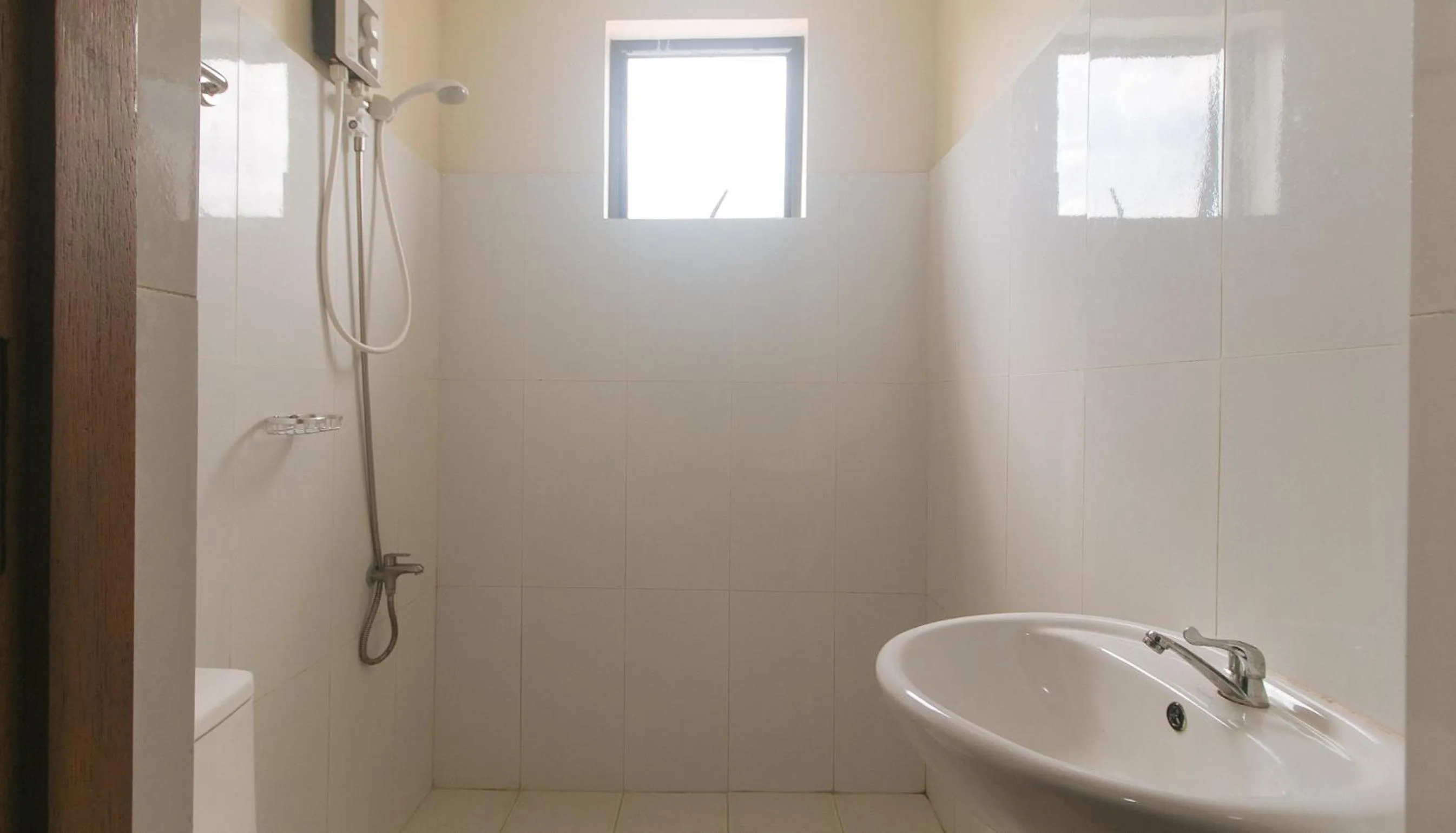 Shower in Avelida Homes by RedDoorz