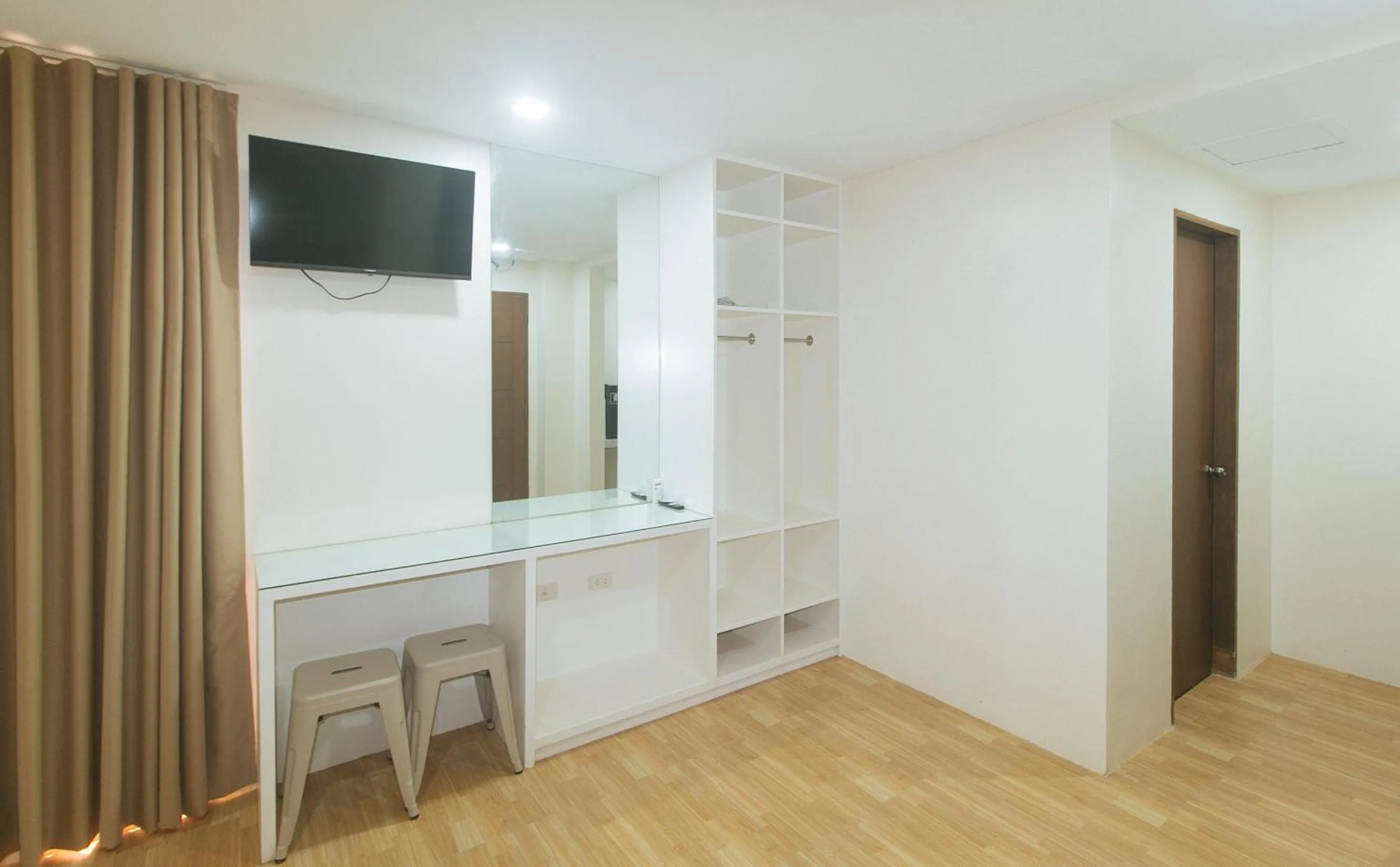 TV and multimedia in Avelida Homes by RedDoorz