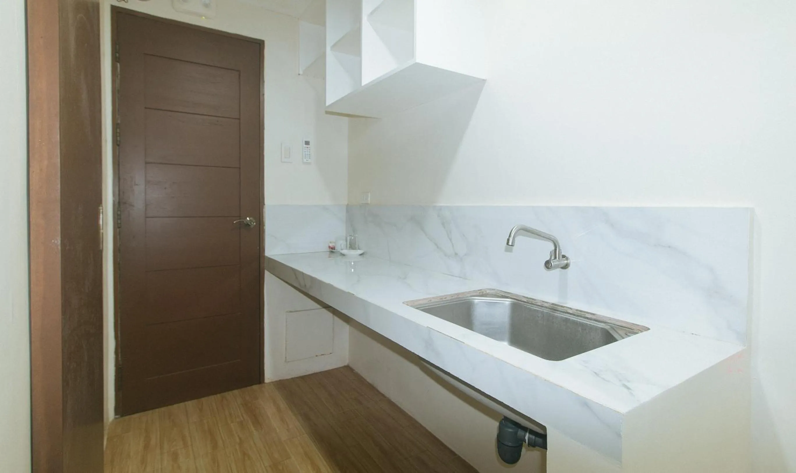 Kitchen or kitchenette in Avelida Homes by RedDoorz