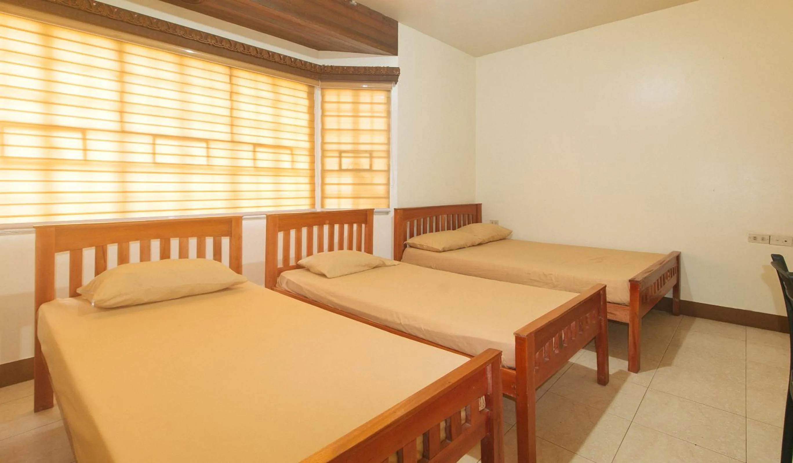 Photo of the whole room, Bed in Kababayan Pensione House by RedDoorz