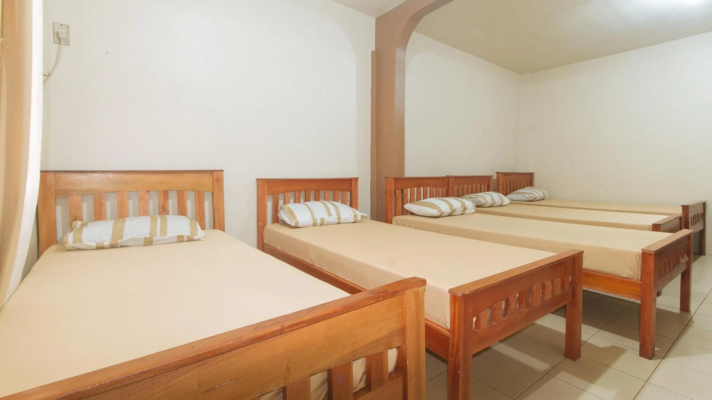 Photo of the whole room, Bed in Kababayan Pensione House by RedDoorz