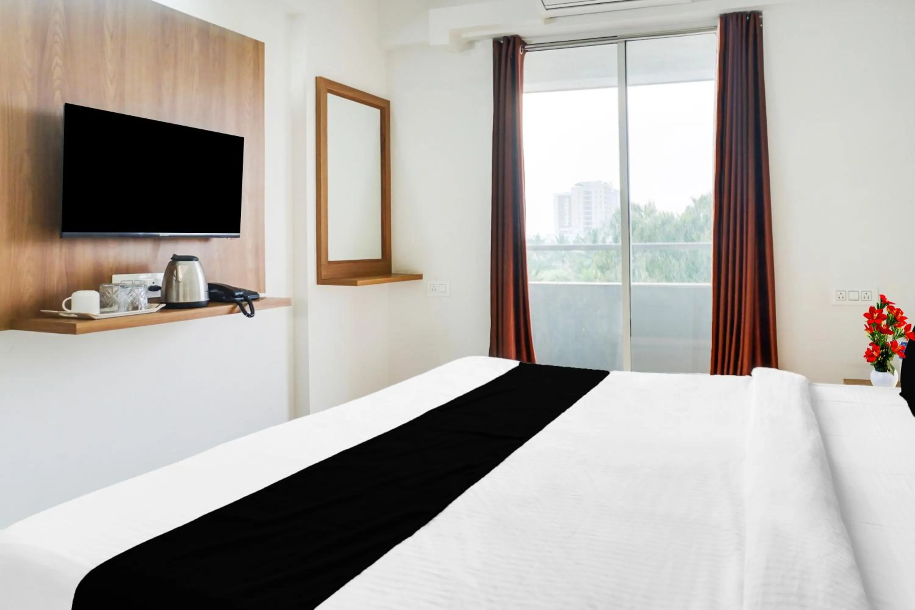 Bedroom, Bed in Super Townhouse Lohegaon Near Pune Airport formerly Landmark Regency