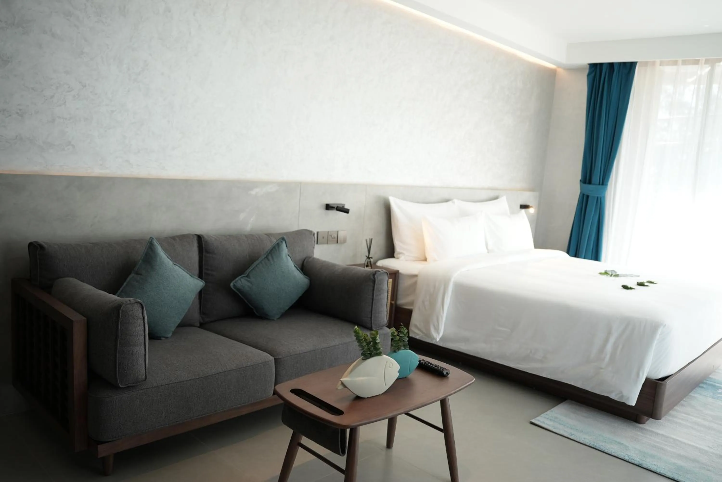 Seating area, Bed in Kora Beach Resort Phuket