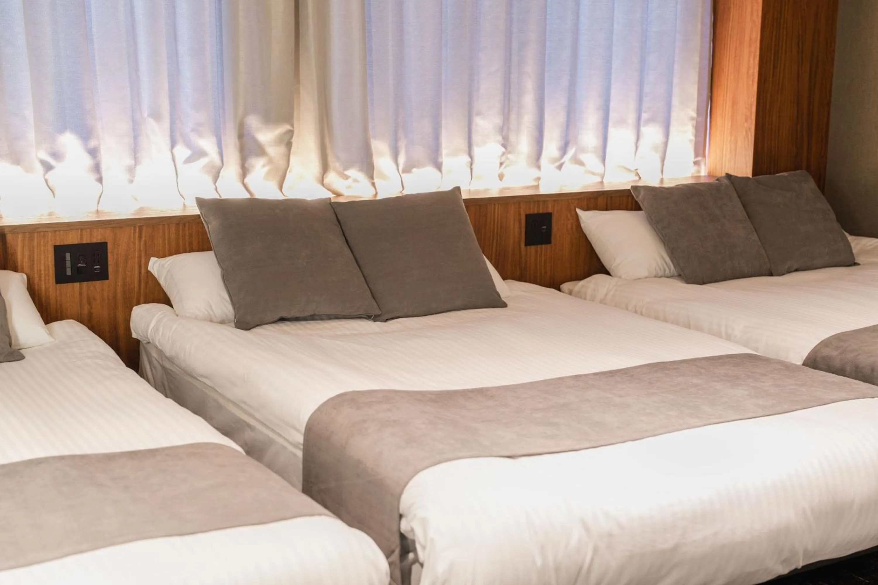 Bed in The LOFT INN HAKATA