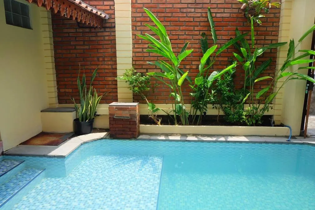 Pool view in Sabi House Lesmana 2 by Simply Homy