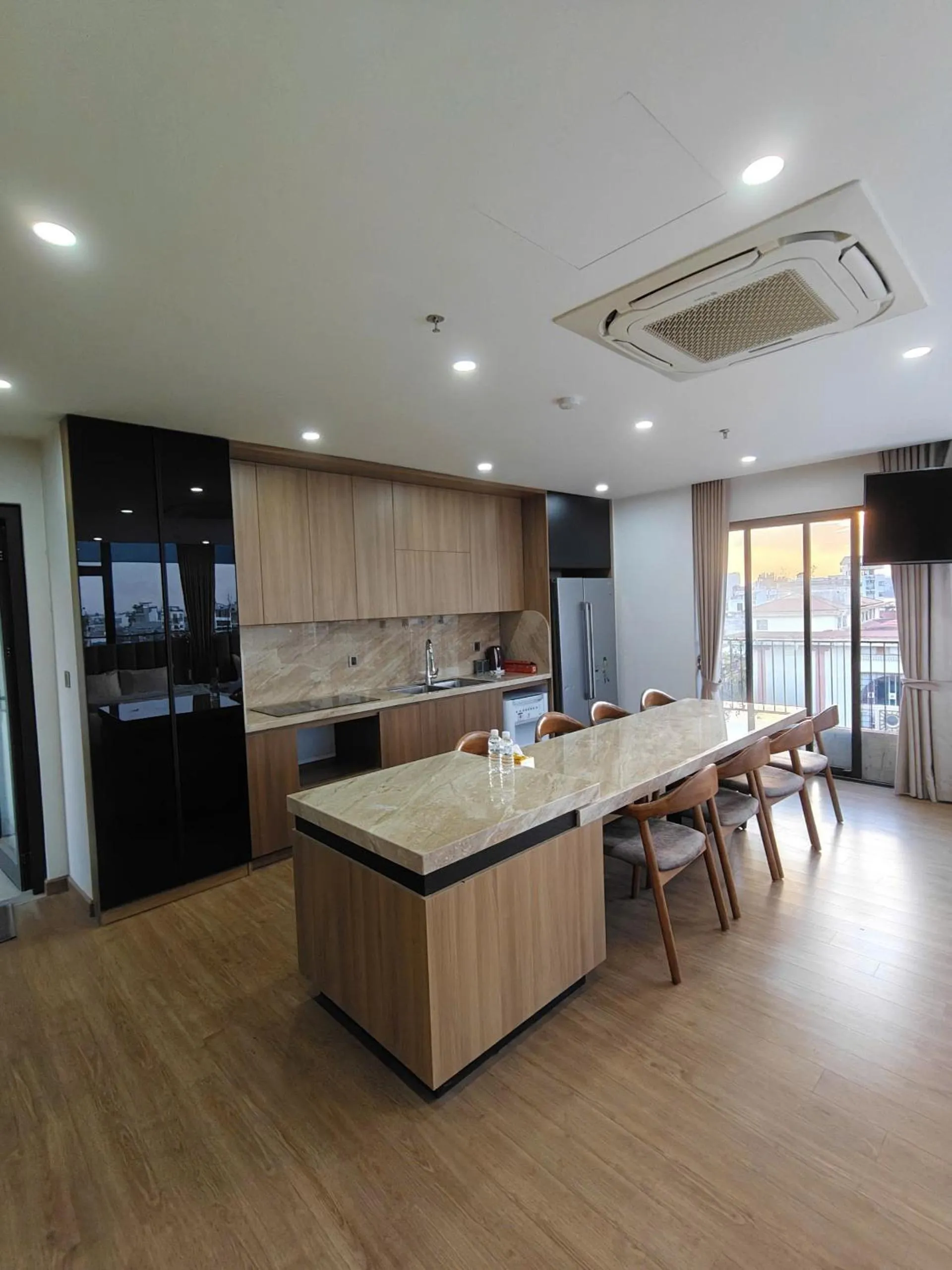 Kitchen or kitchenette in MOONLIT Suites Hotel by Luxe Paradise