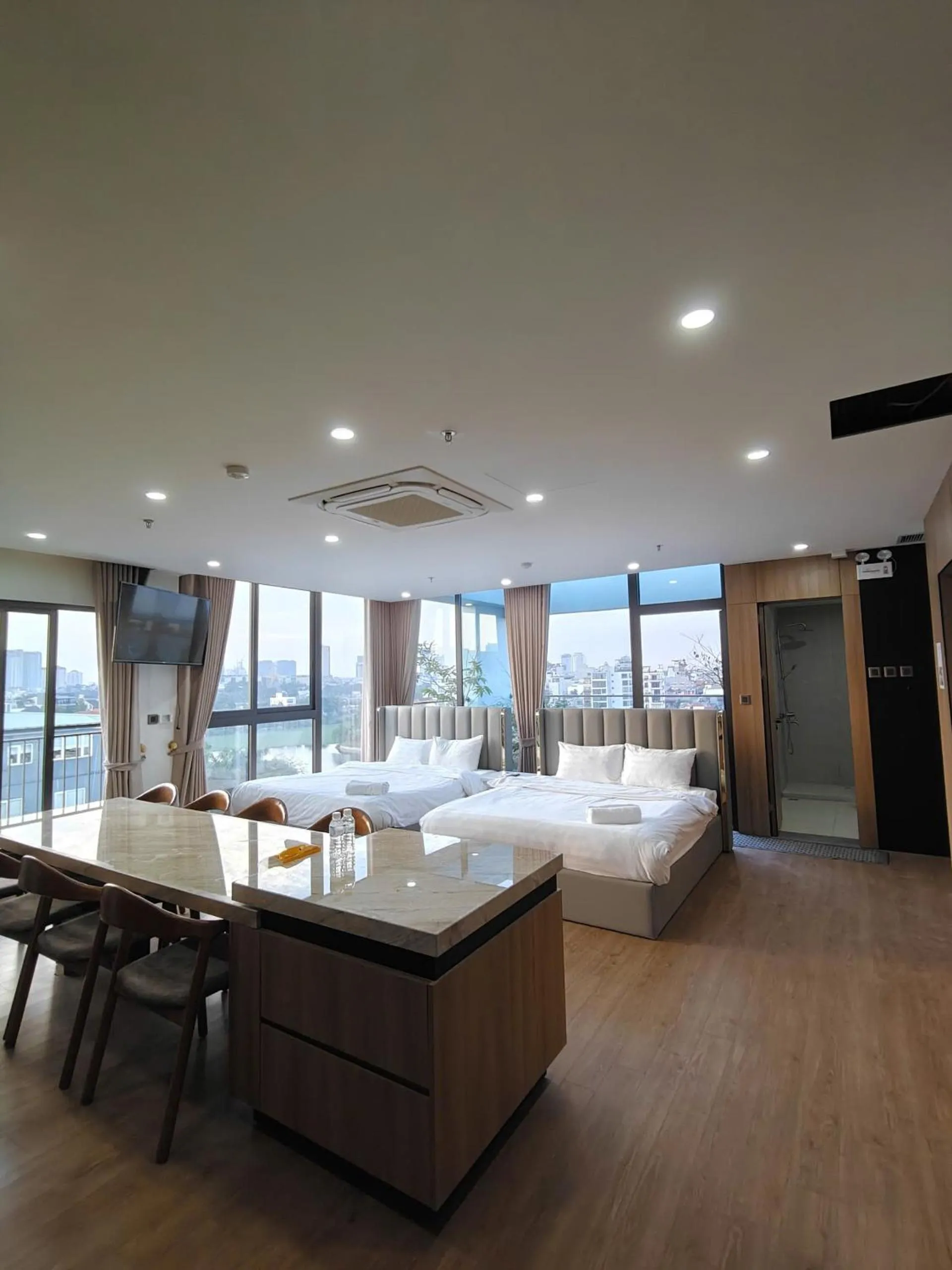 Photo of the whole room, Bed in MOONLIT Suites Hotel by Luxe Paradise