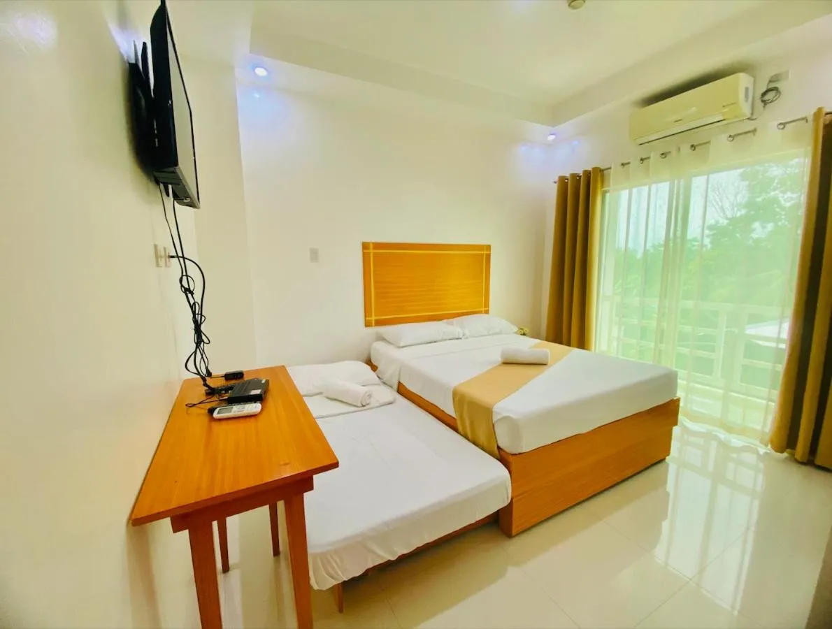 Bed in Cherry's Courtyard Hotel