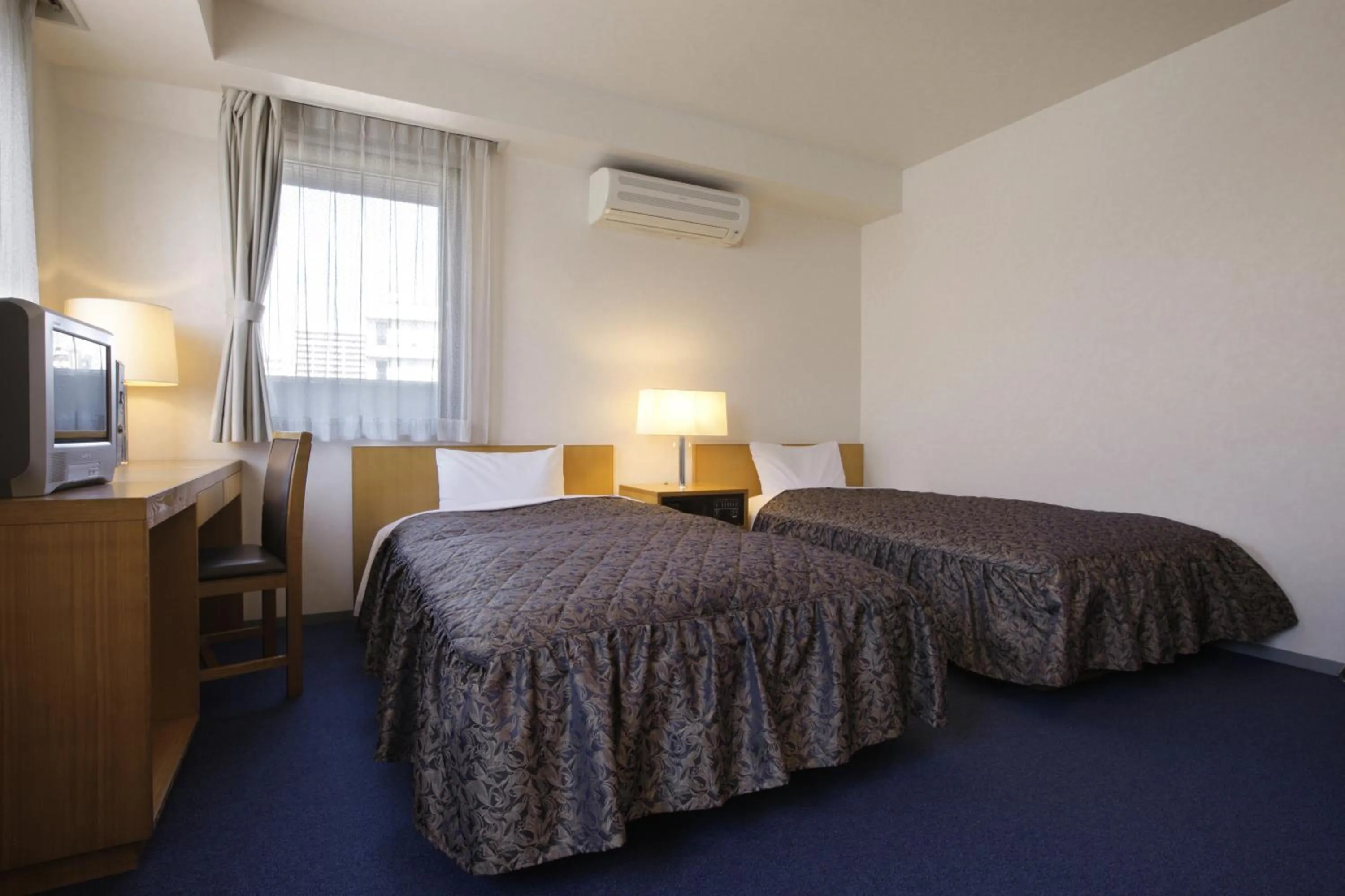 Bed in Sankei City Hotel Hachioji