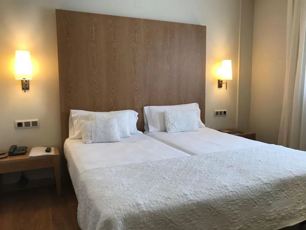 Bed in Hotel Entredos