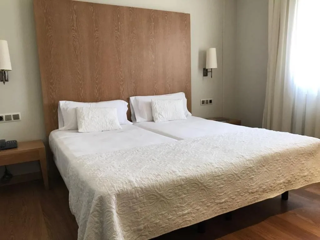 Bed in Hotel Entredos