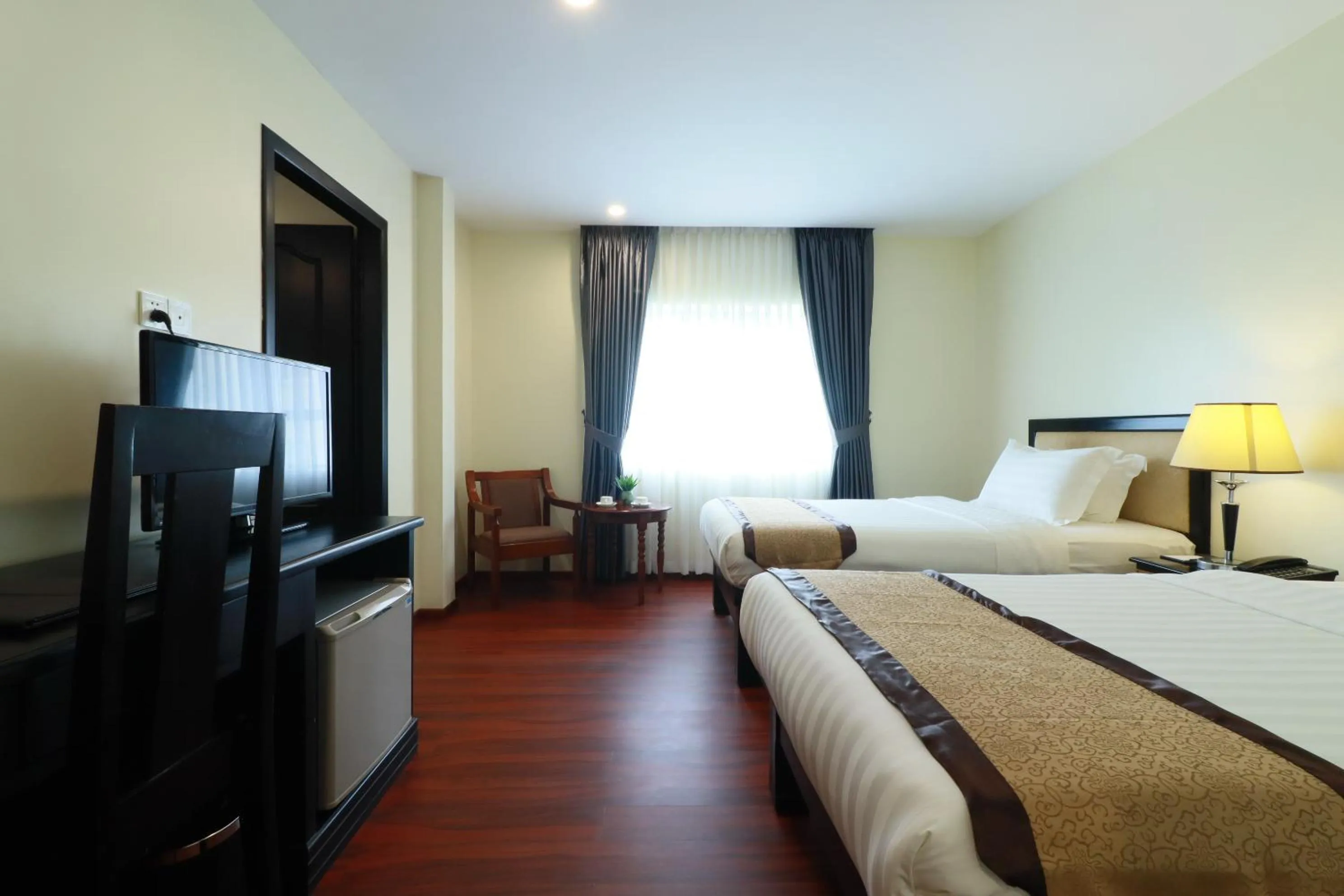 Bed in Mahasakor Inn