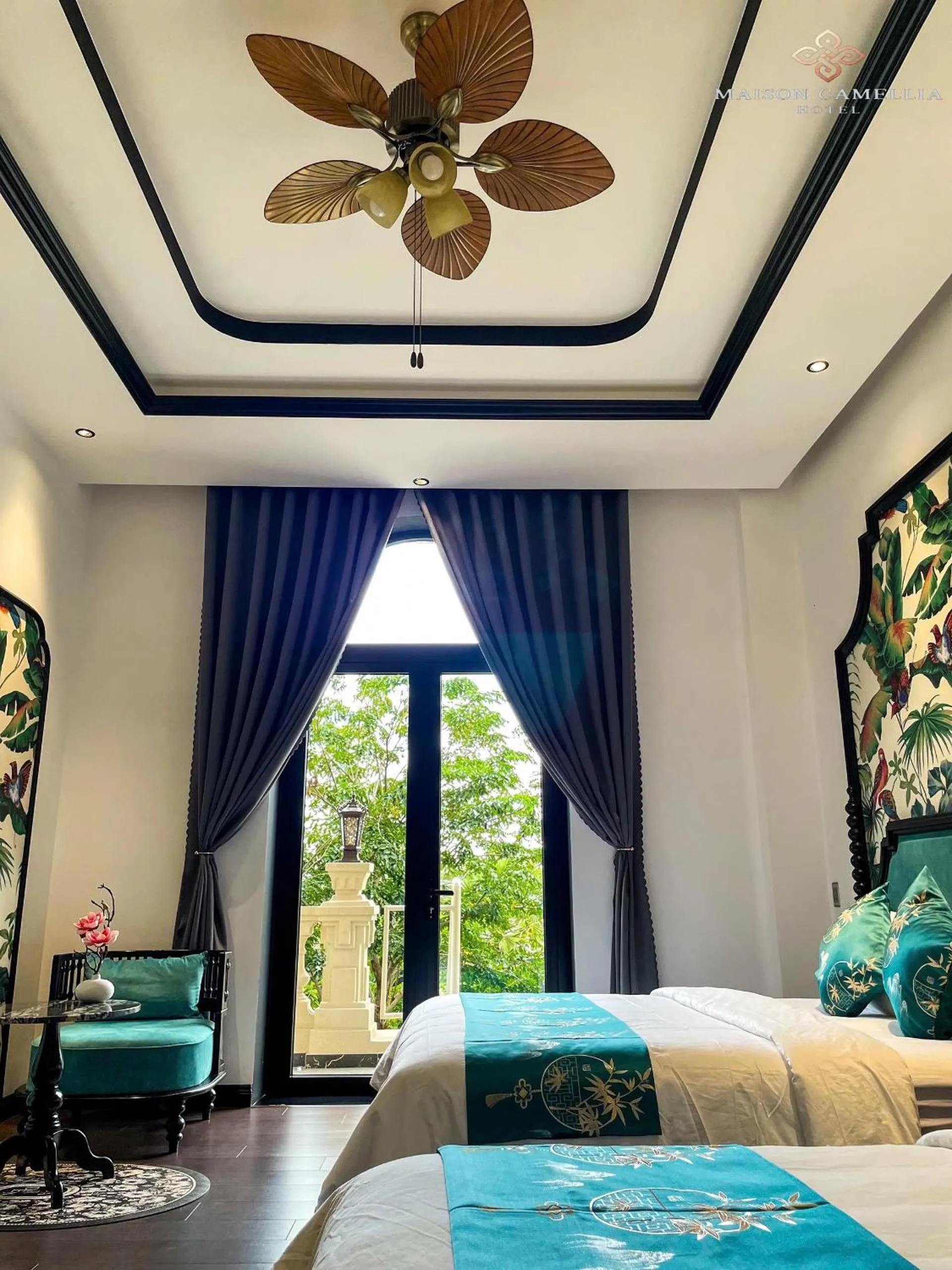 Bed in MAISON CAMELLIA Hotel