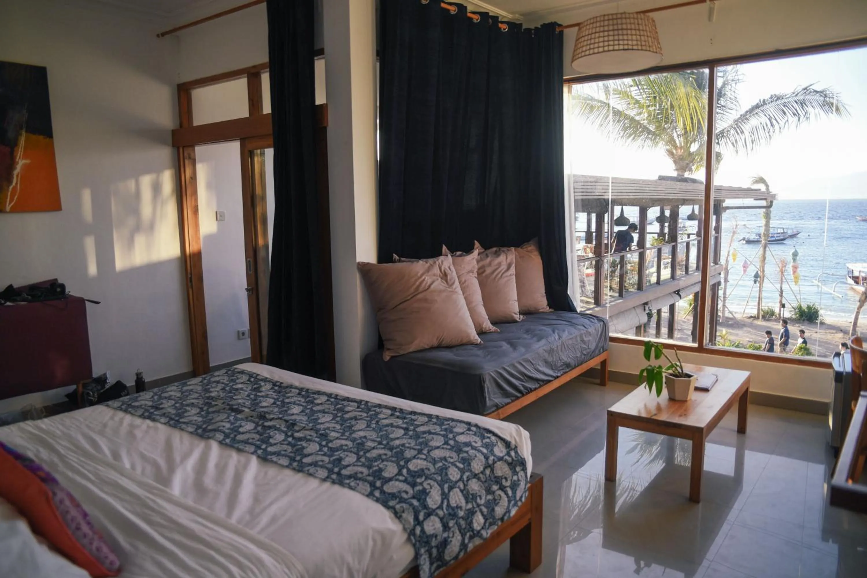 Seating area, Bed in Pesona Beach Resort & Spa - Adults Only