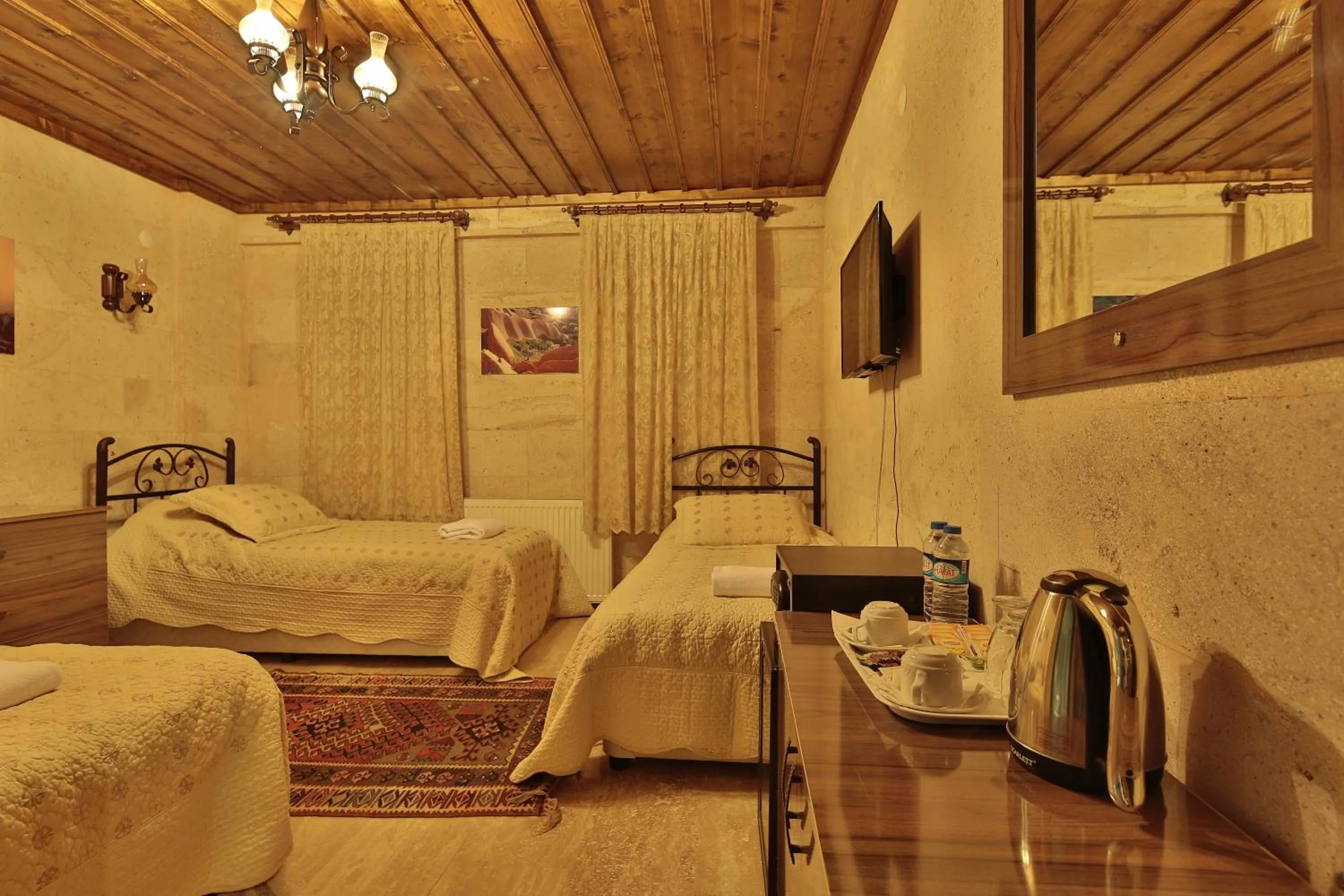 Bed in Goreme Cave Rooms&Pool