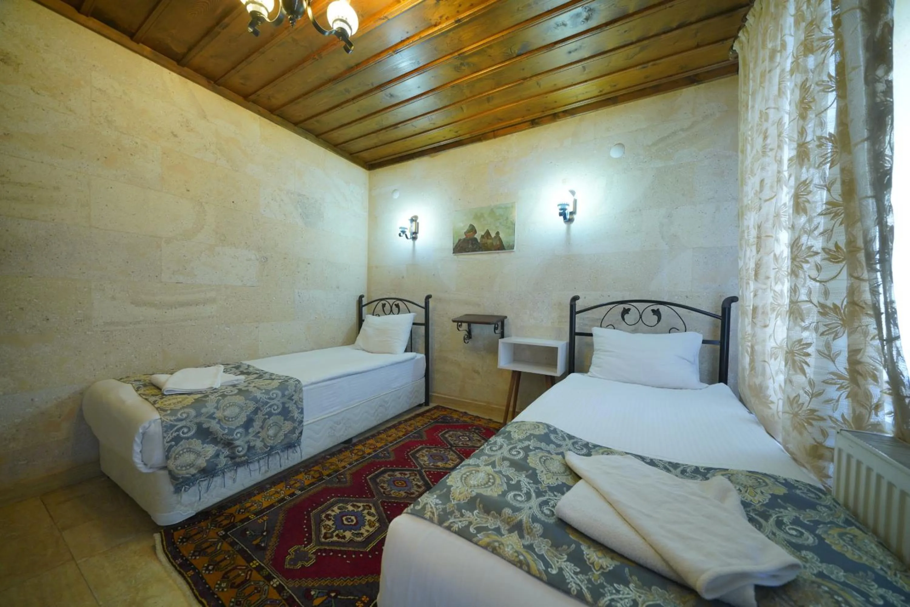 Bed in Goreme Cave Rooms&Pool