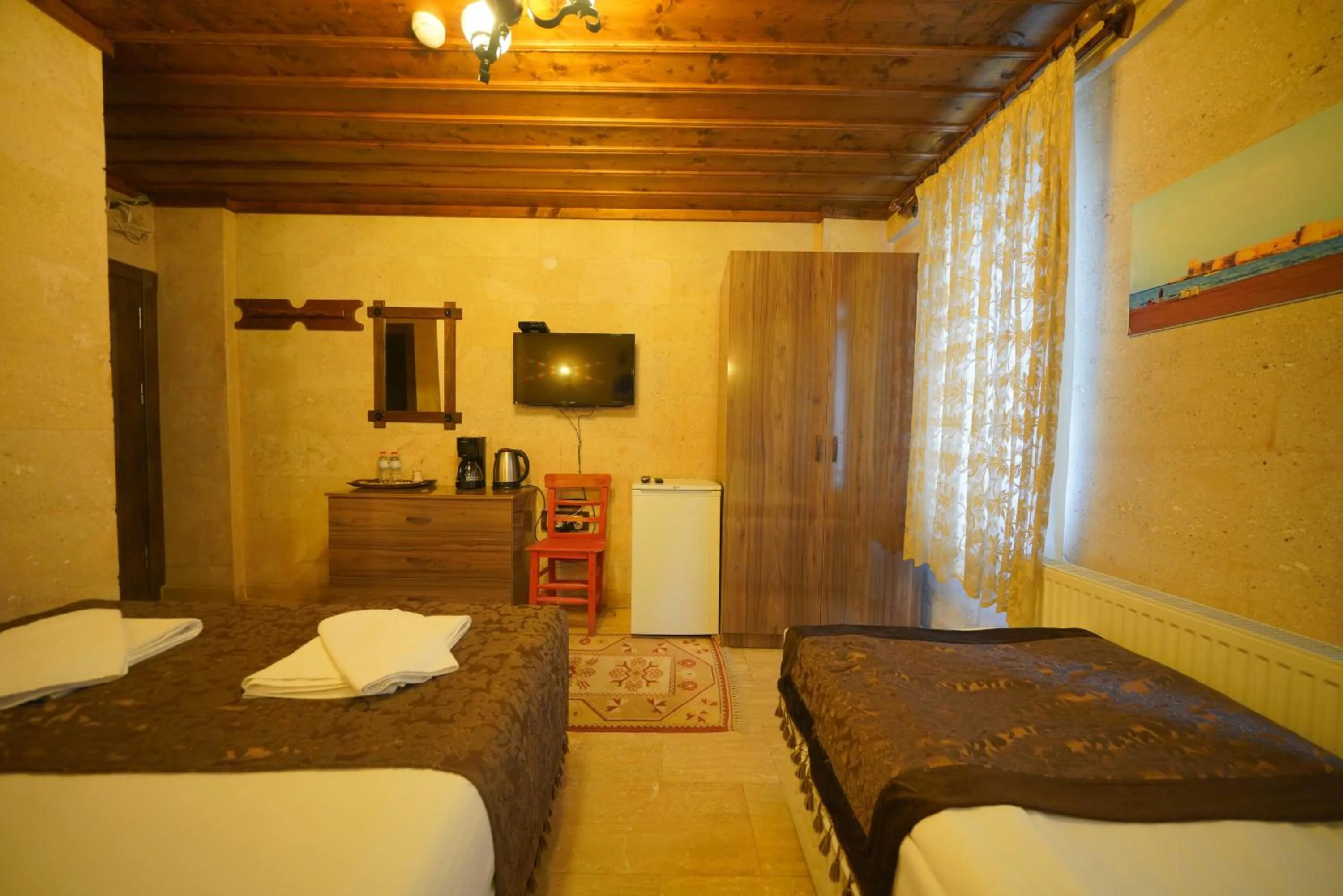 Bed in Goreme Cave Rooms&Pool