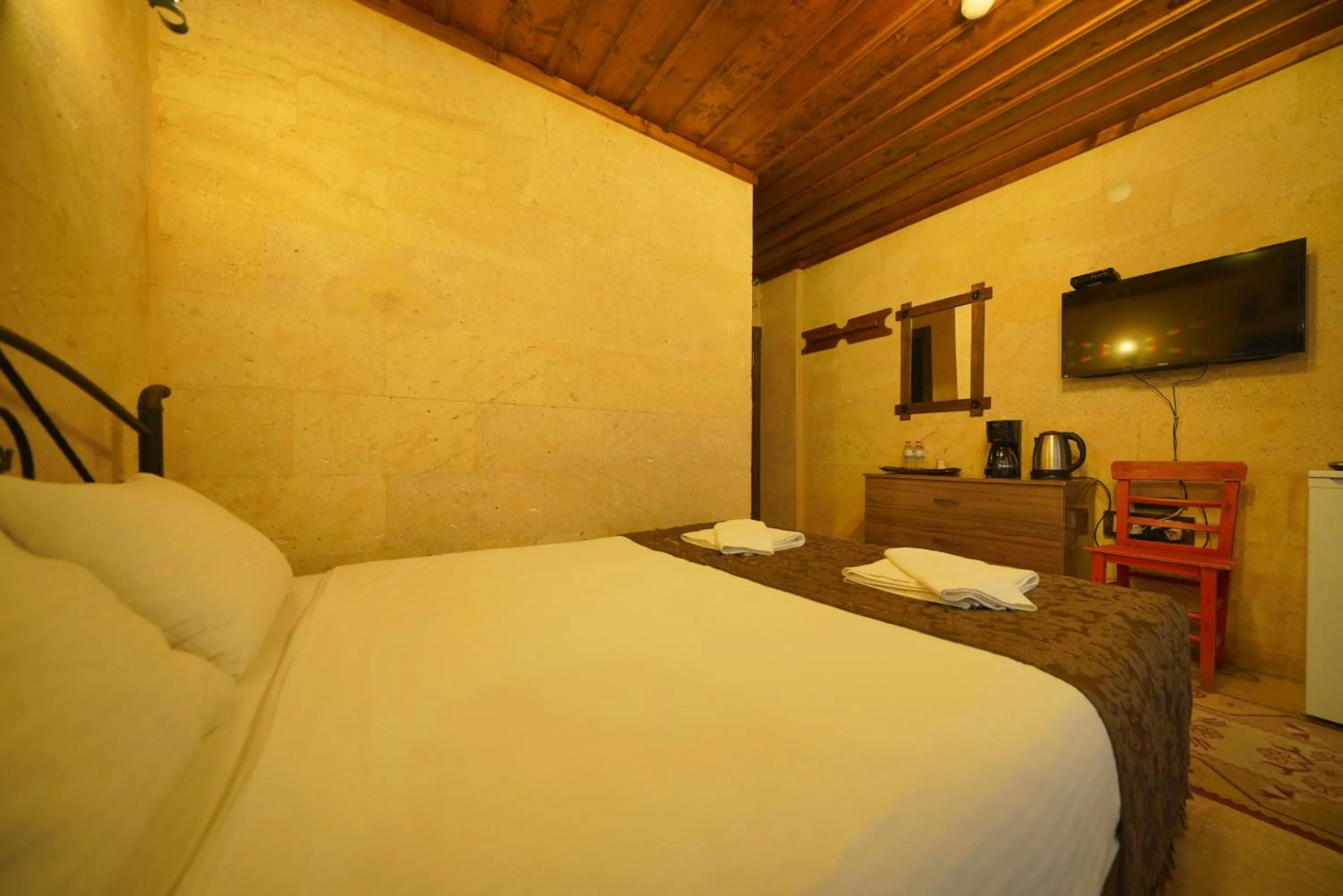 Bed in Goreme Cave Rooms&Pool