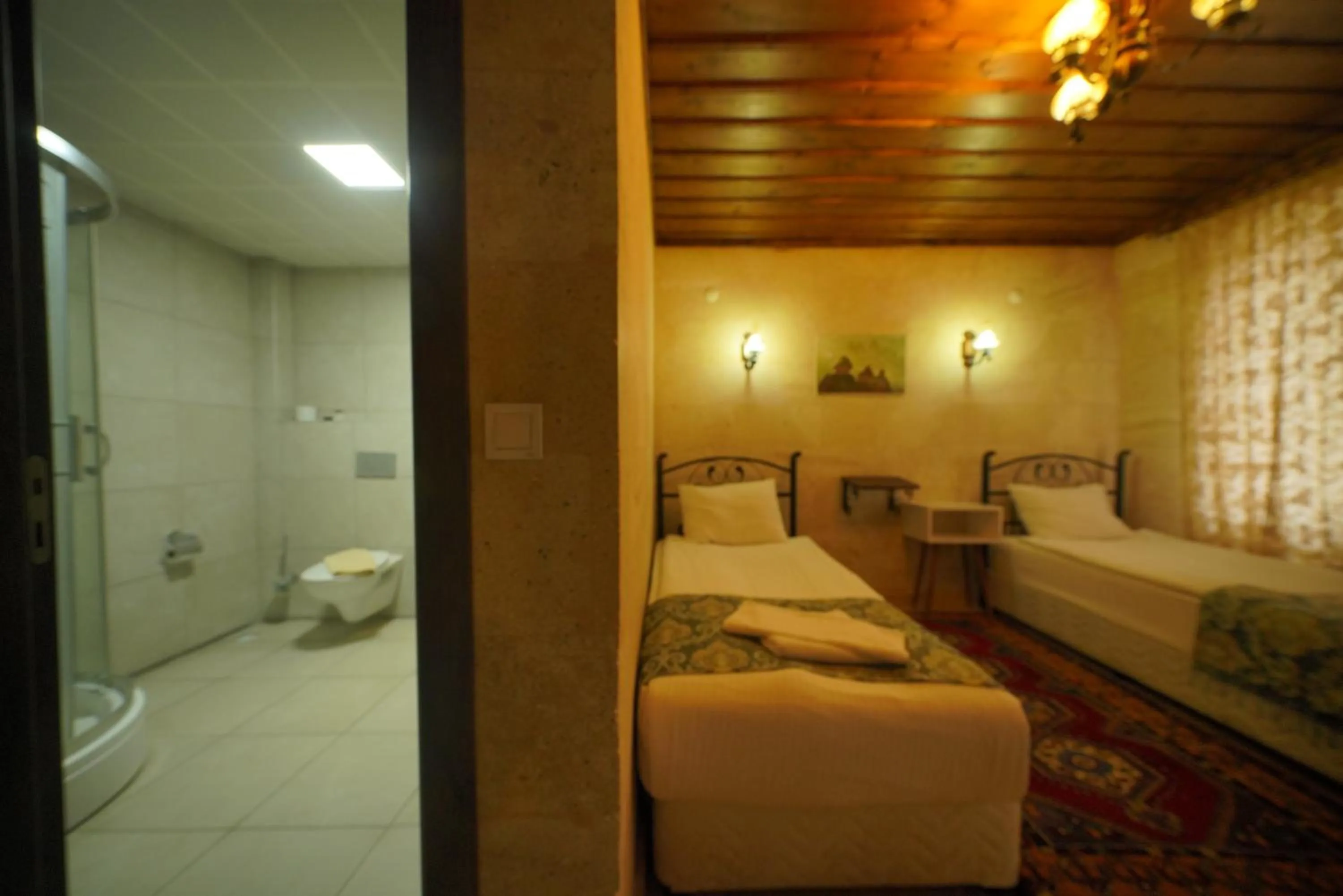 Bed in Goreme Cave Rooms&Pool