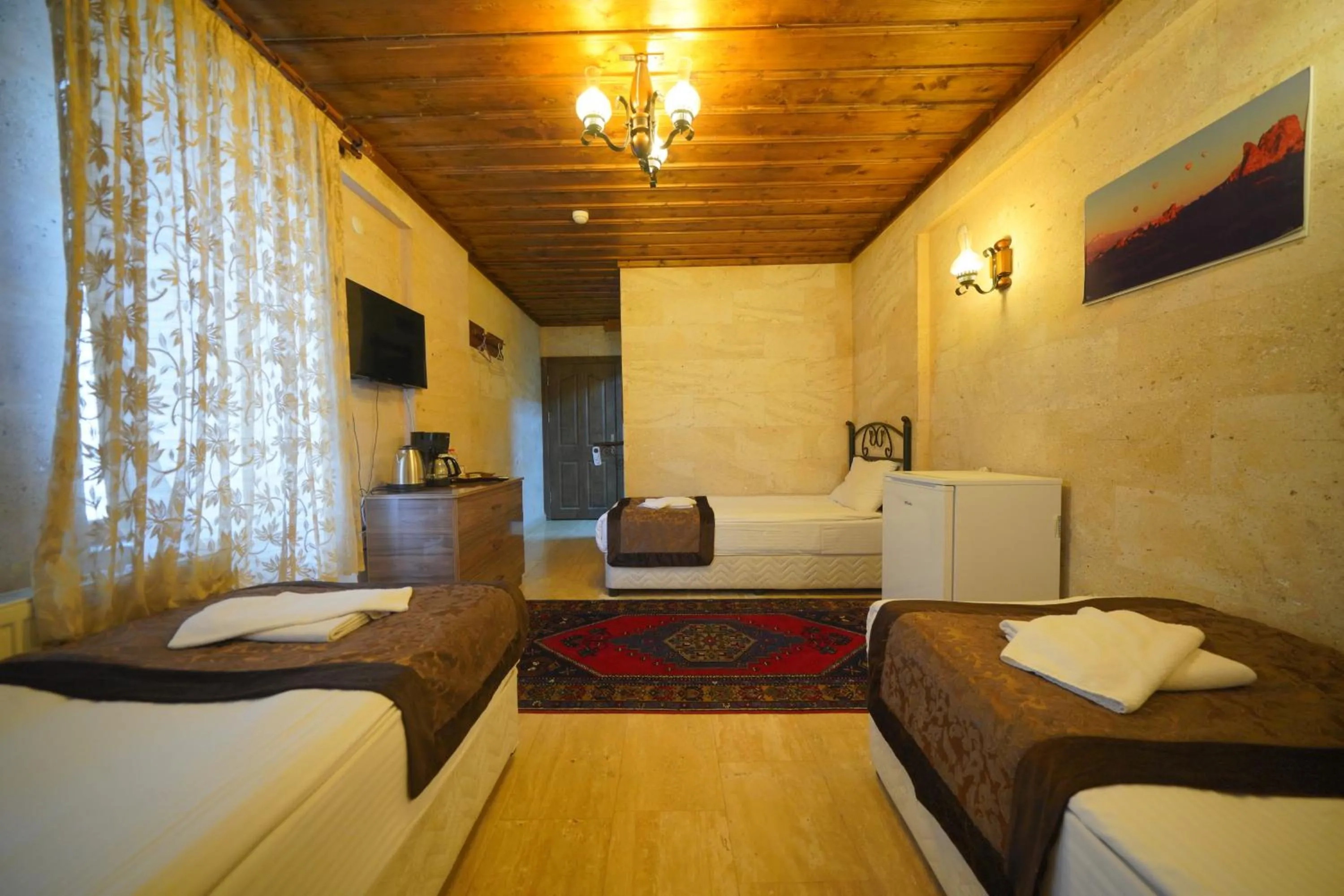 Bed in Goreme Cave Rooms&Pool