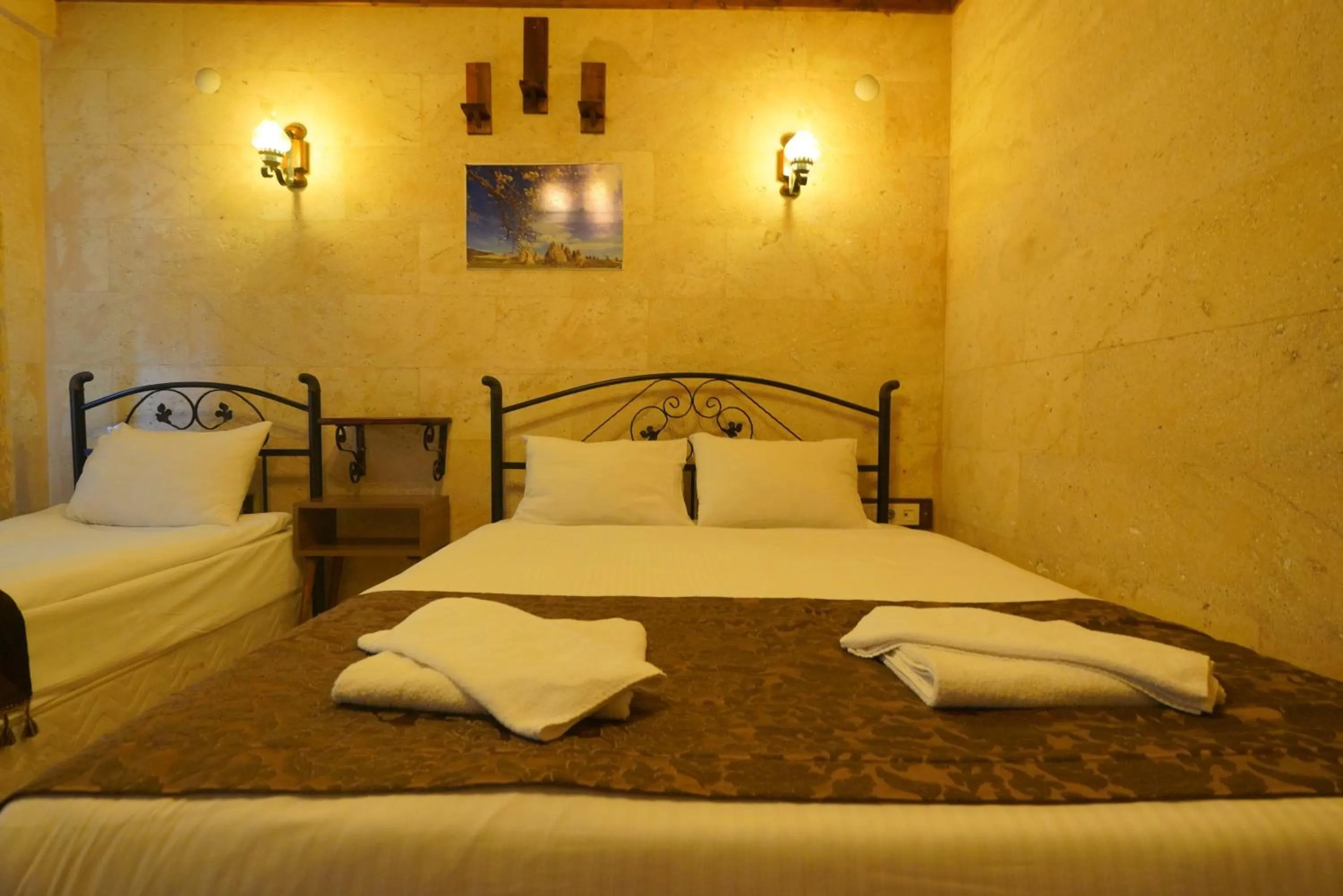 Bed in Goreme Cave Rooms&Pool