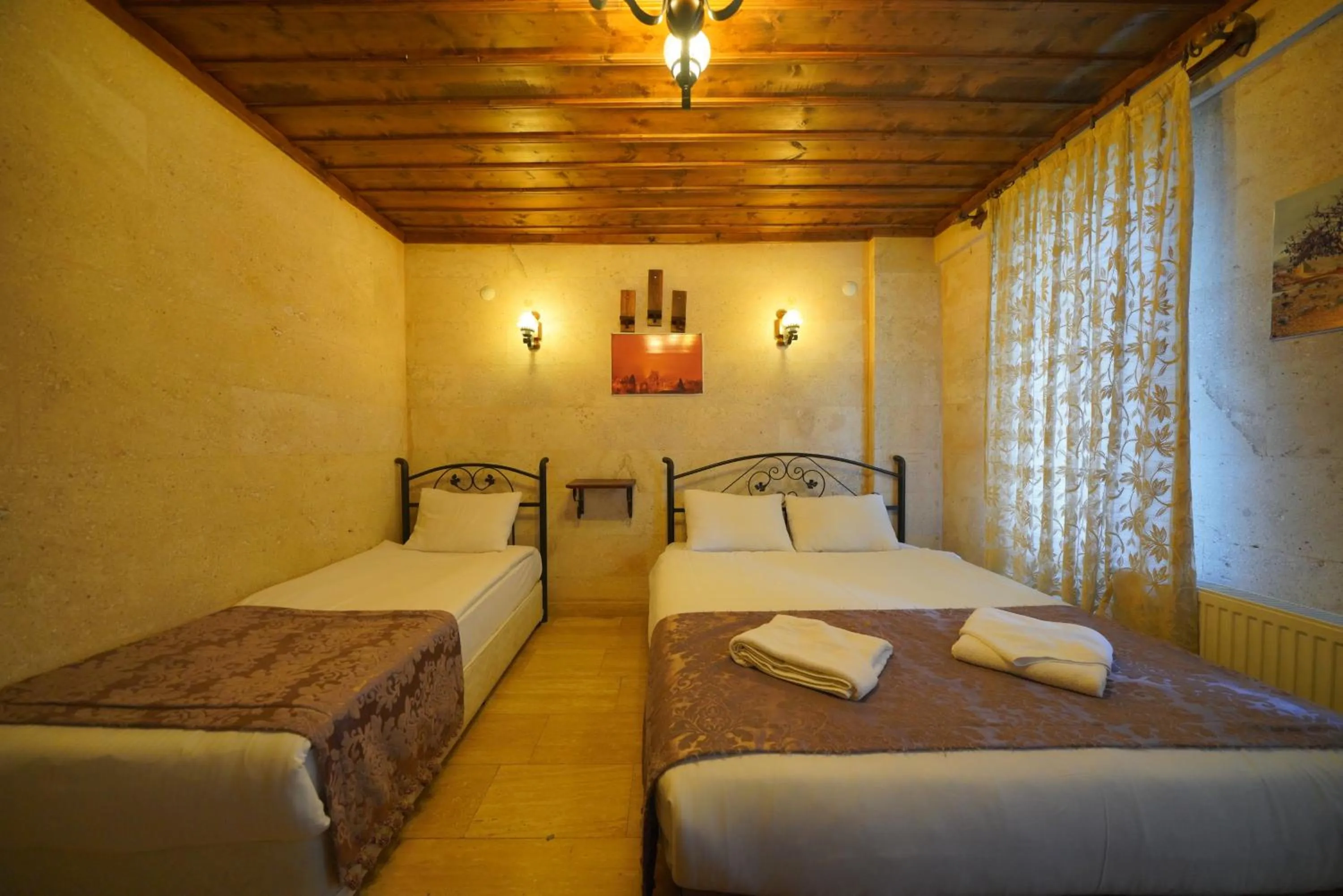 Bed in Goreme Cave Rooms&Pool