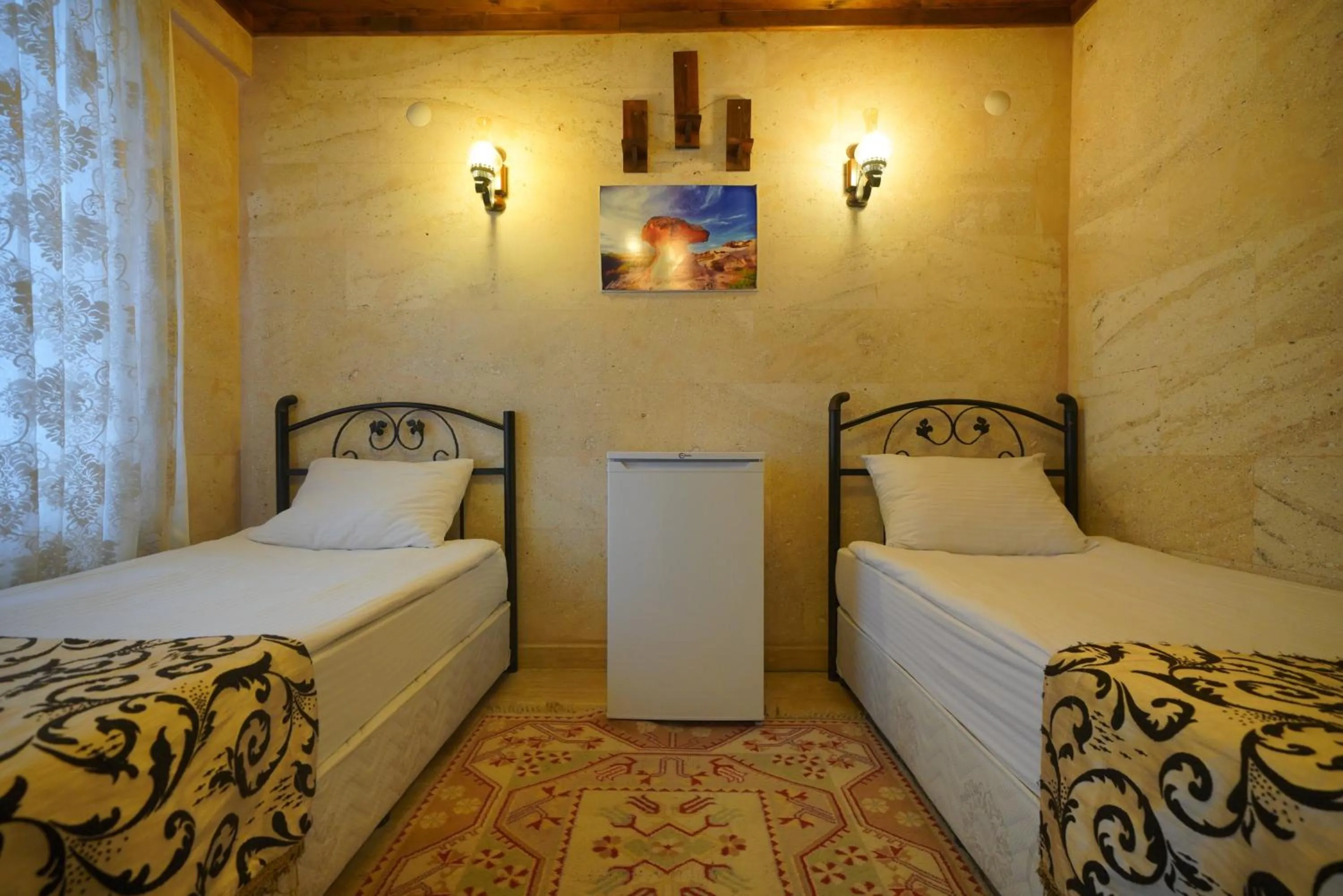 Bed in Goreme Cave Rooms&Pool