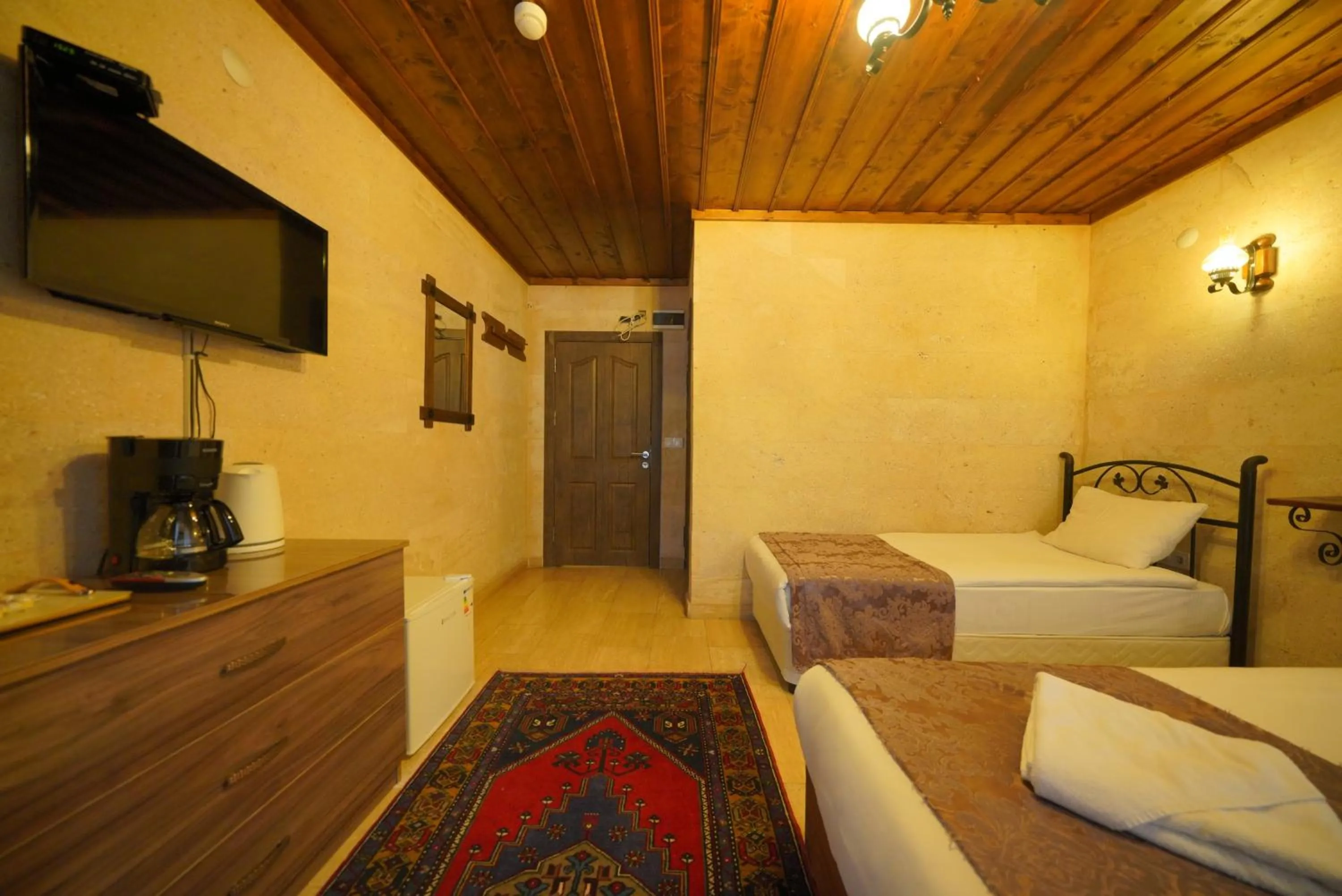 Bed in Goreme Cave Rooms&Pool