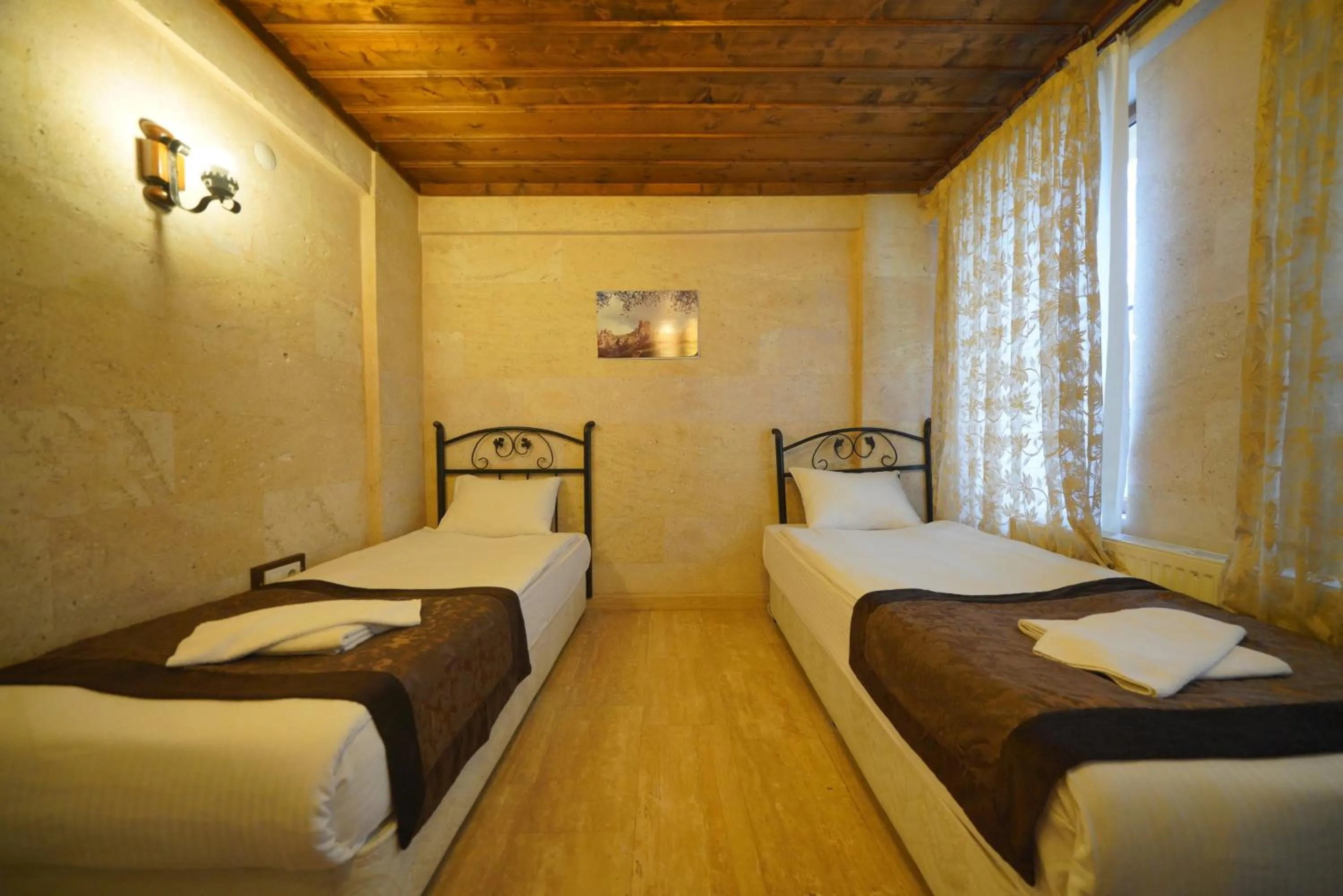 Bed in Goreme Cave Rooms&Pool