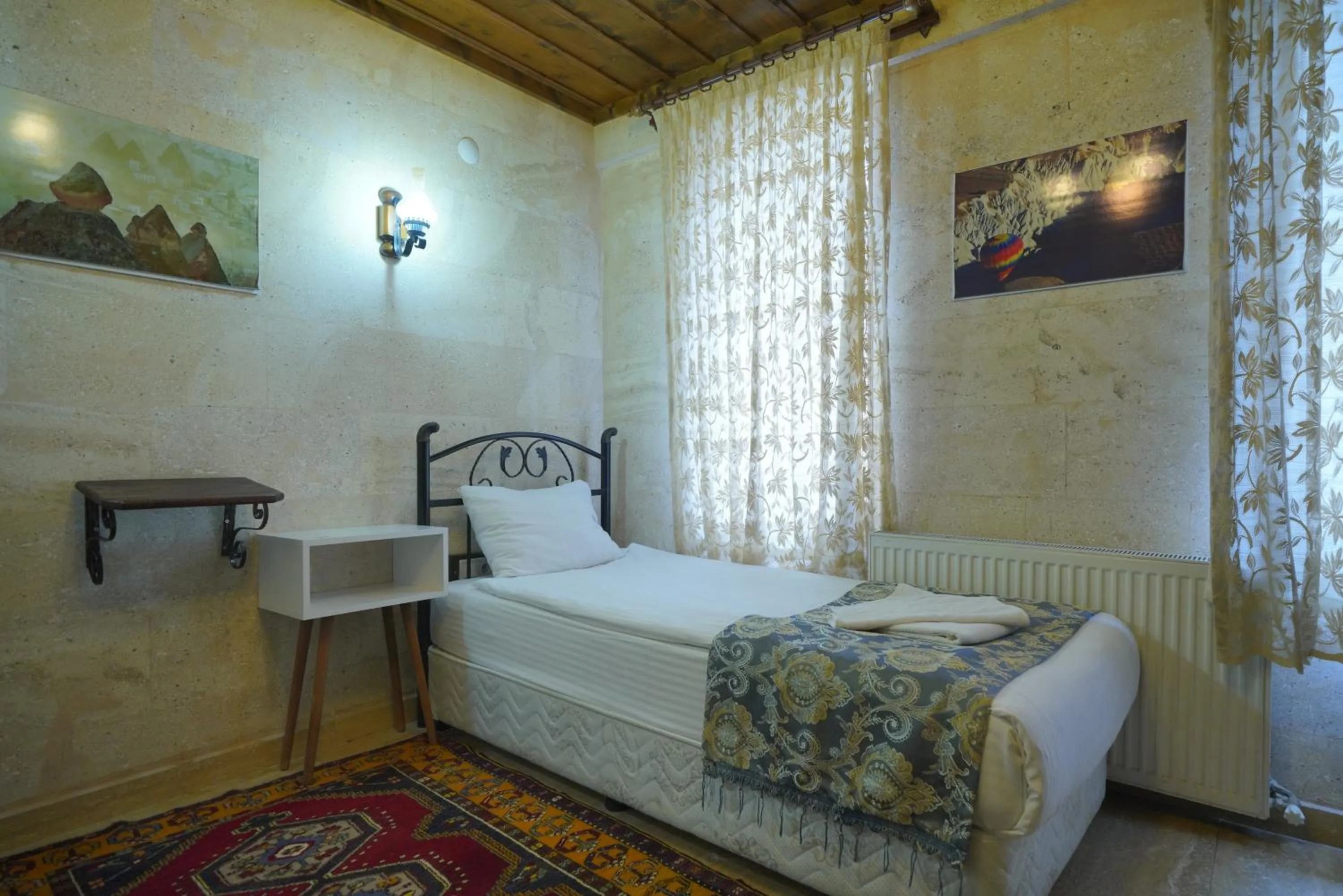 Bed in Goreme Cave Rooms&Pool