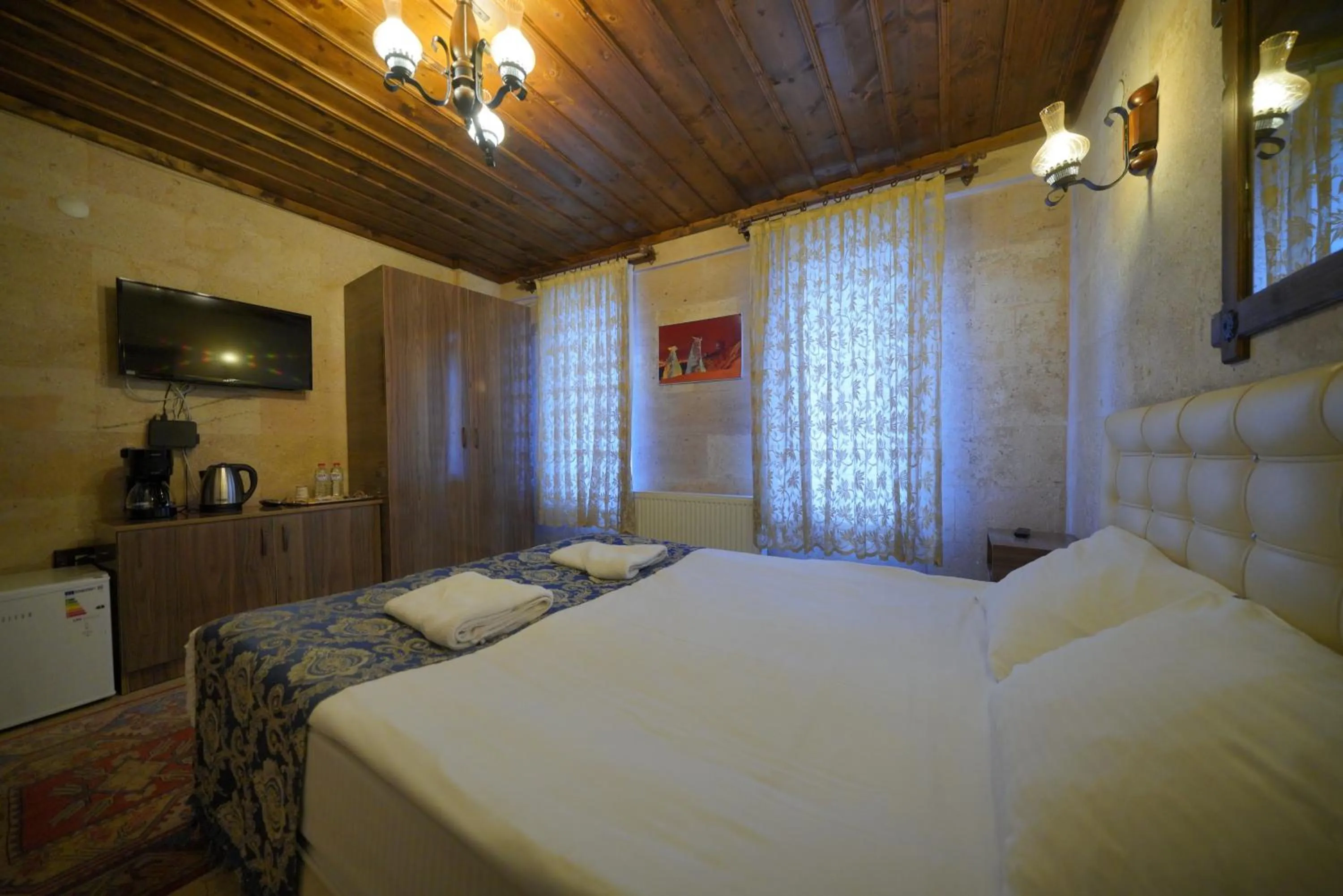 Bed in Goreme Cave Rooms&Pool