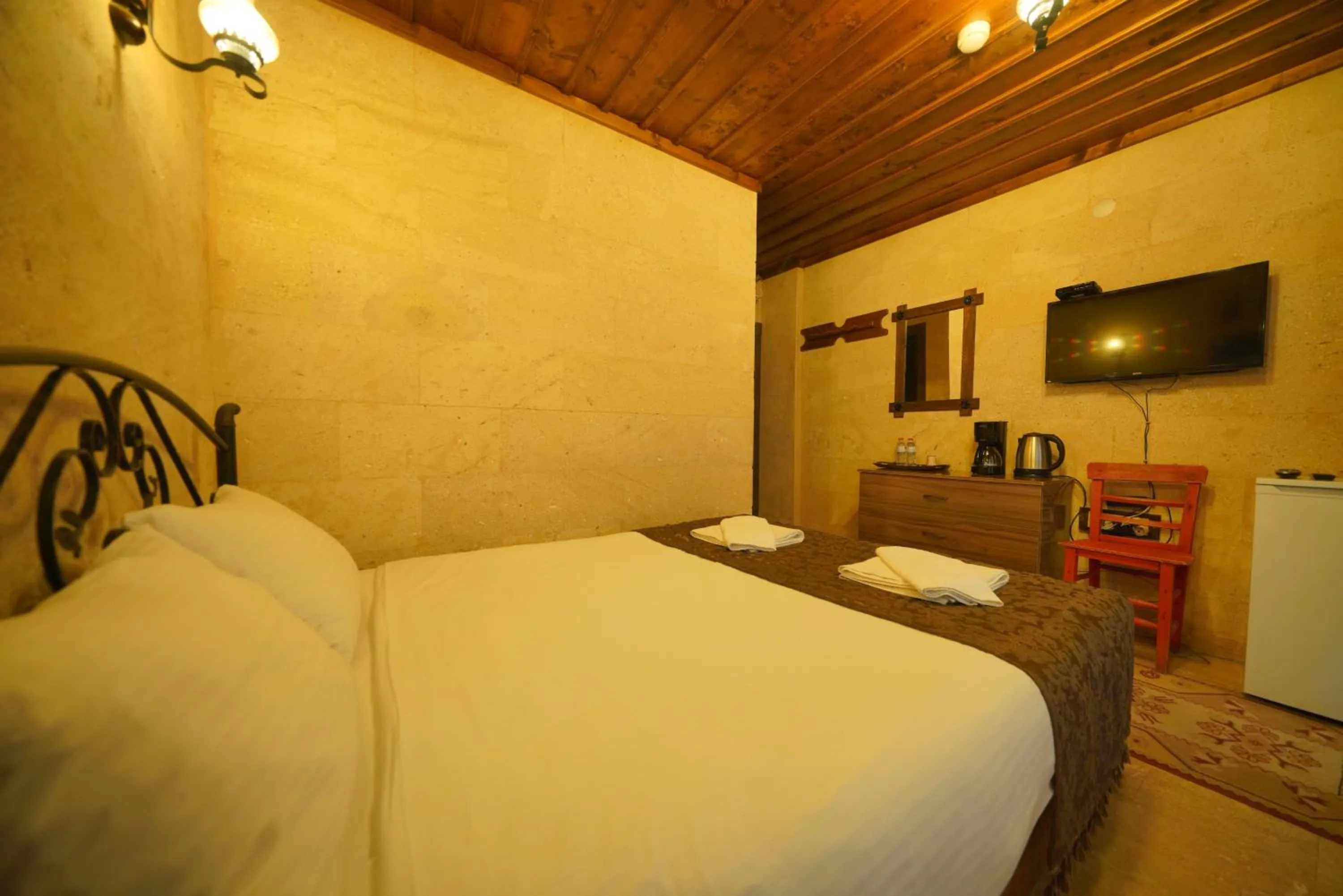 Bed in Goreme Cave Rooms&Pool