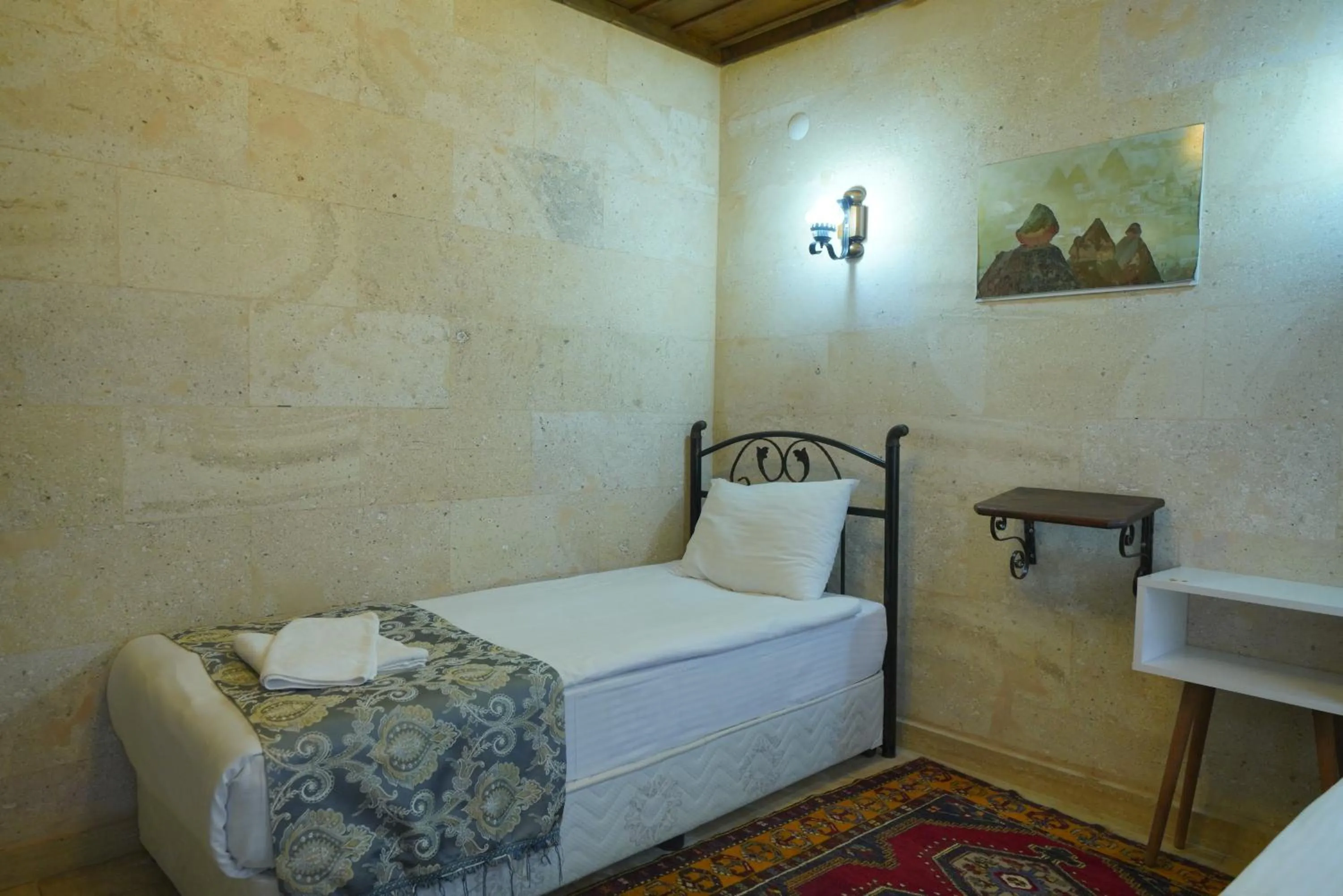 Bed in Goreme Cave Rooms&Pool