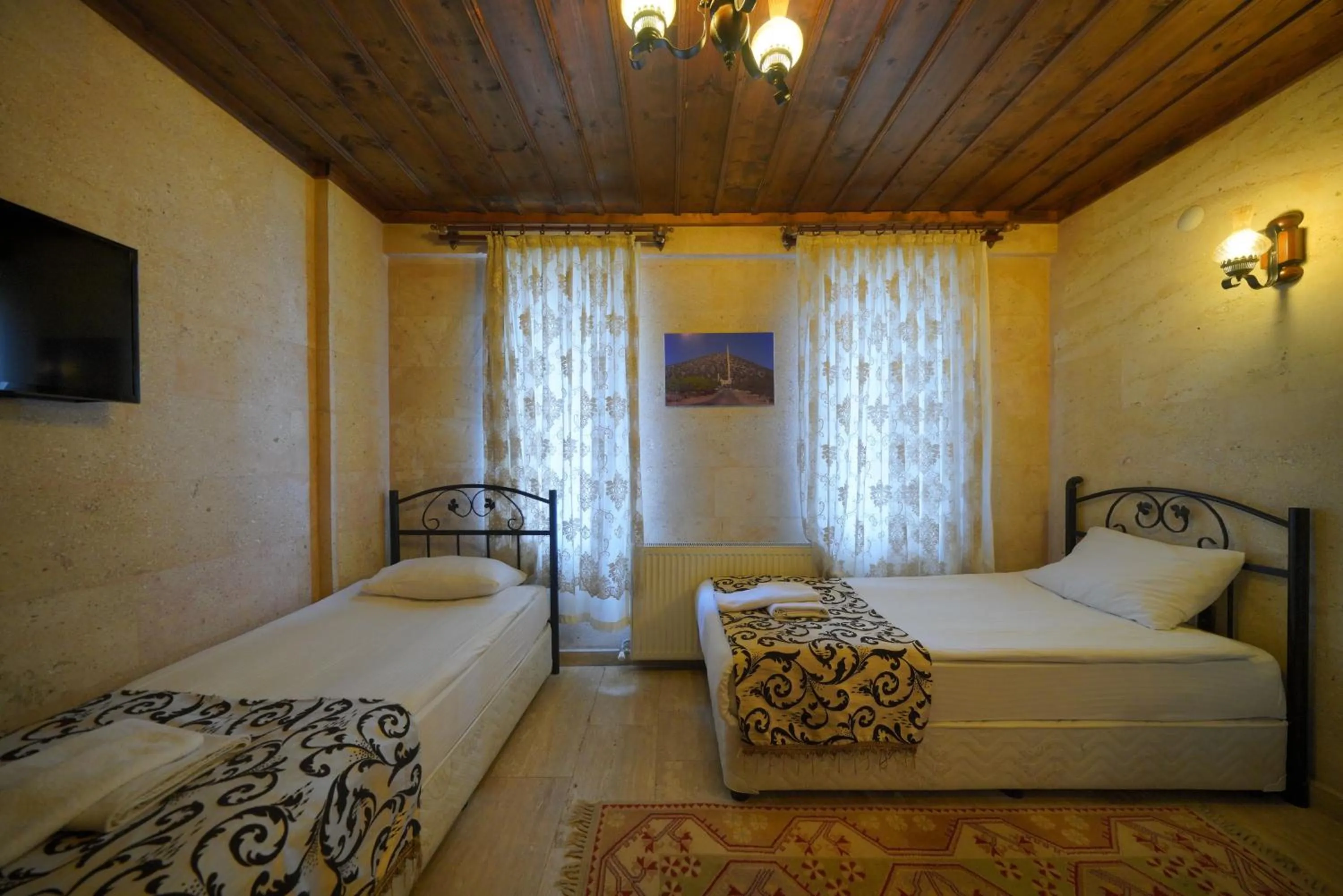 Bed in Goreme Cave Rooms&Pool