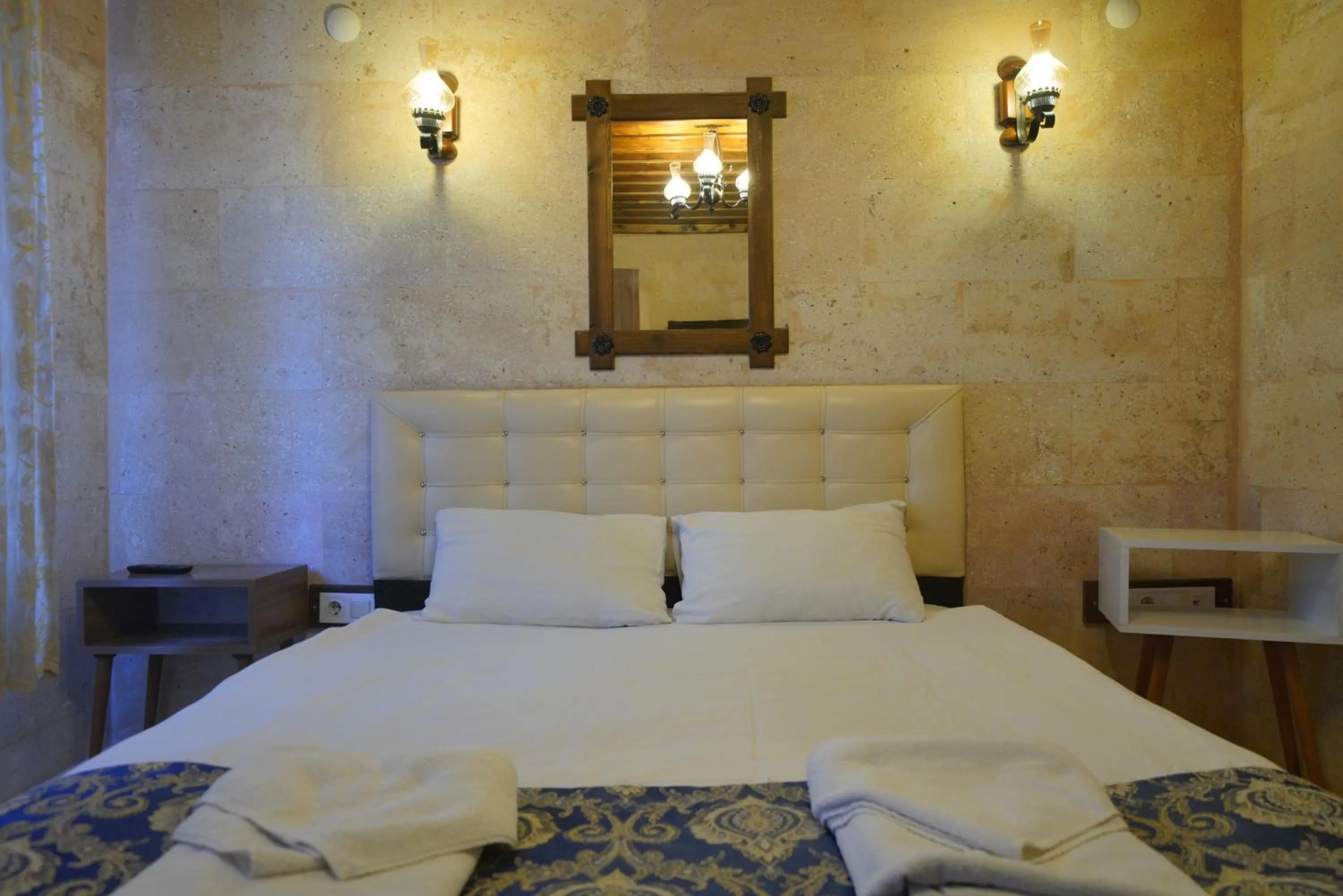 Bed in Goreme Cave Rooms&Pool